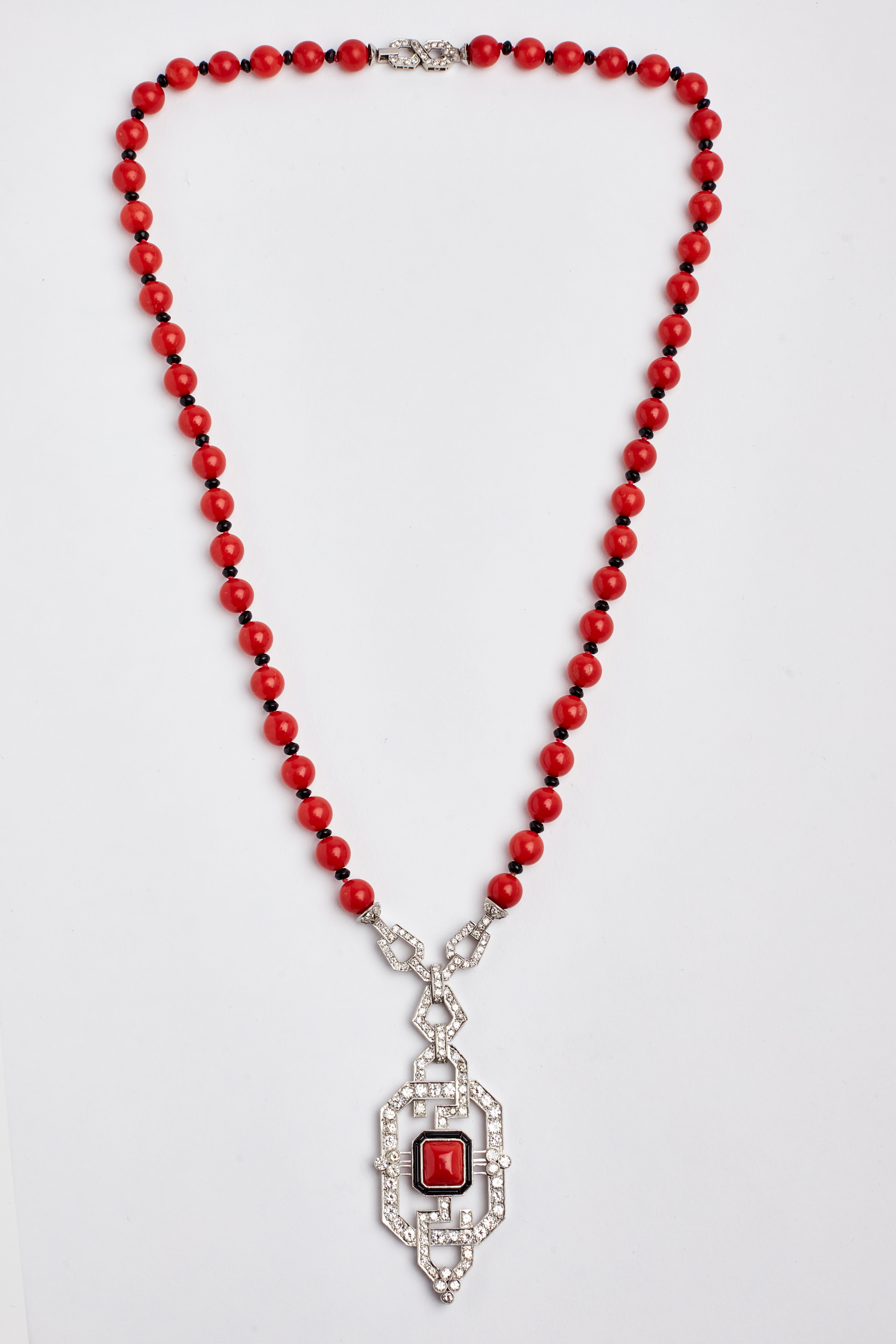 Platinum white Diamond Coral and Onyx Necklace. 16 inches long. Full diamond clasp. 