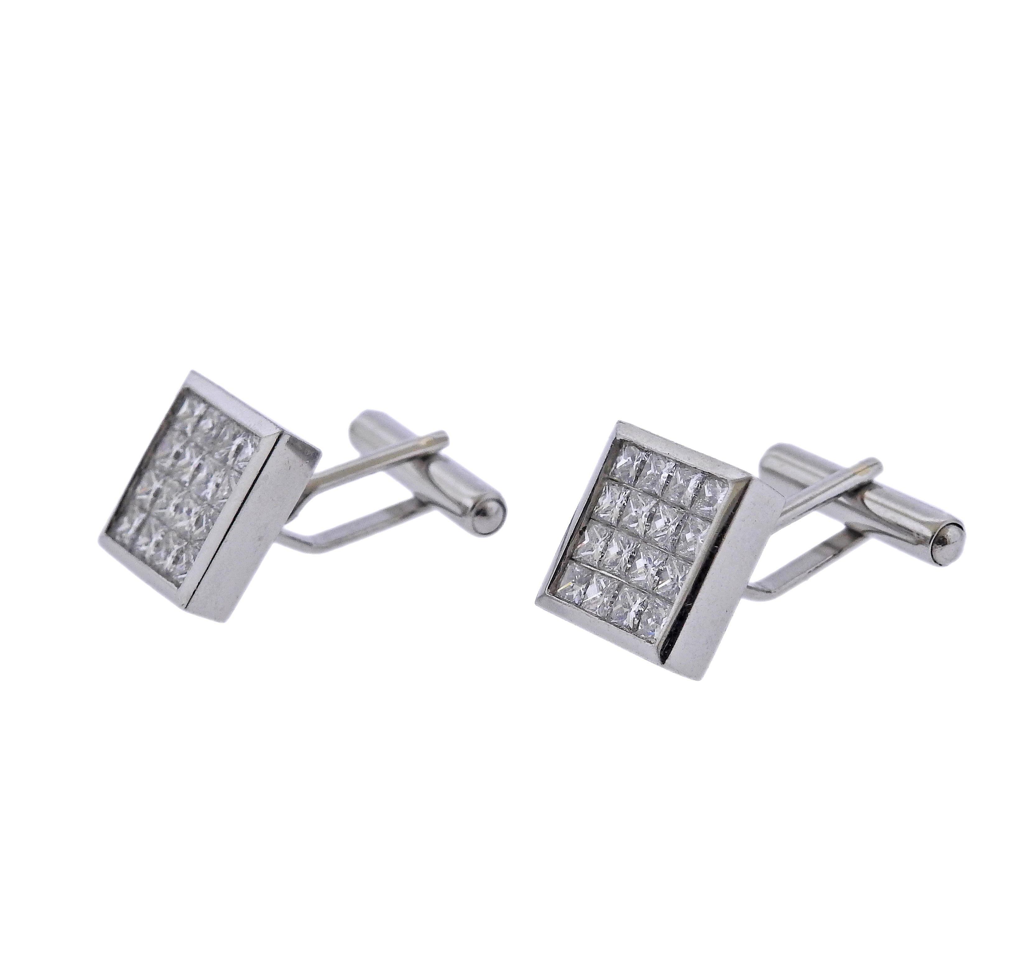 Exquisite platinum dress set of cufflinks and studs, with approx. 8.50ctw in GH/VS diamonds. Cufflink top is 14mm x 14mm, stud top - 10mm x 10mm. Weight - 53.6 grams. Marked Plat.