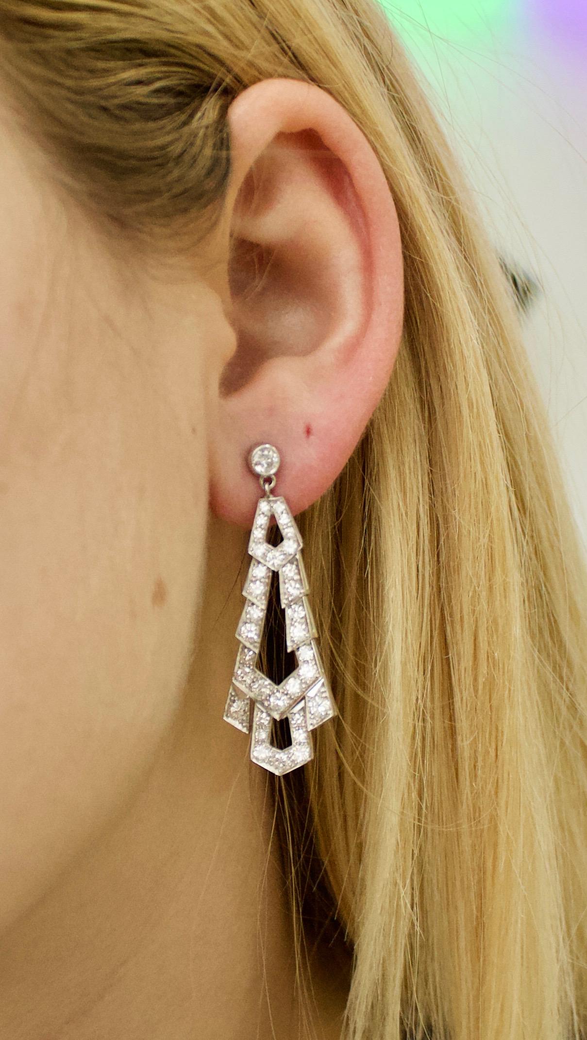 Platinum Diamond Dangling Earrings Circa 1940's
Sixty Six Round Brilliant Cut Diamonds Weighing 3.2 Carats Approximately [GH VVS-VS]