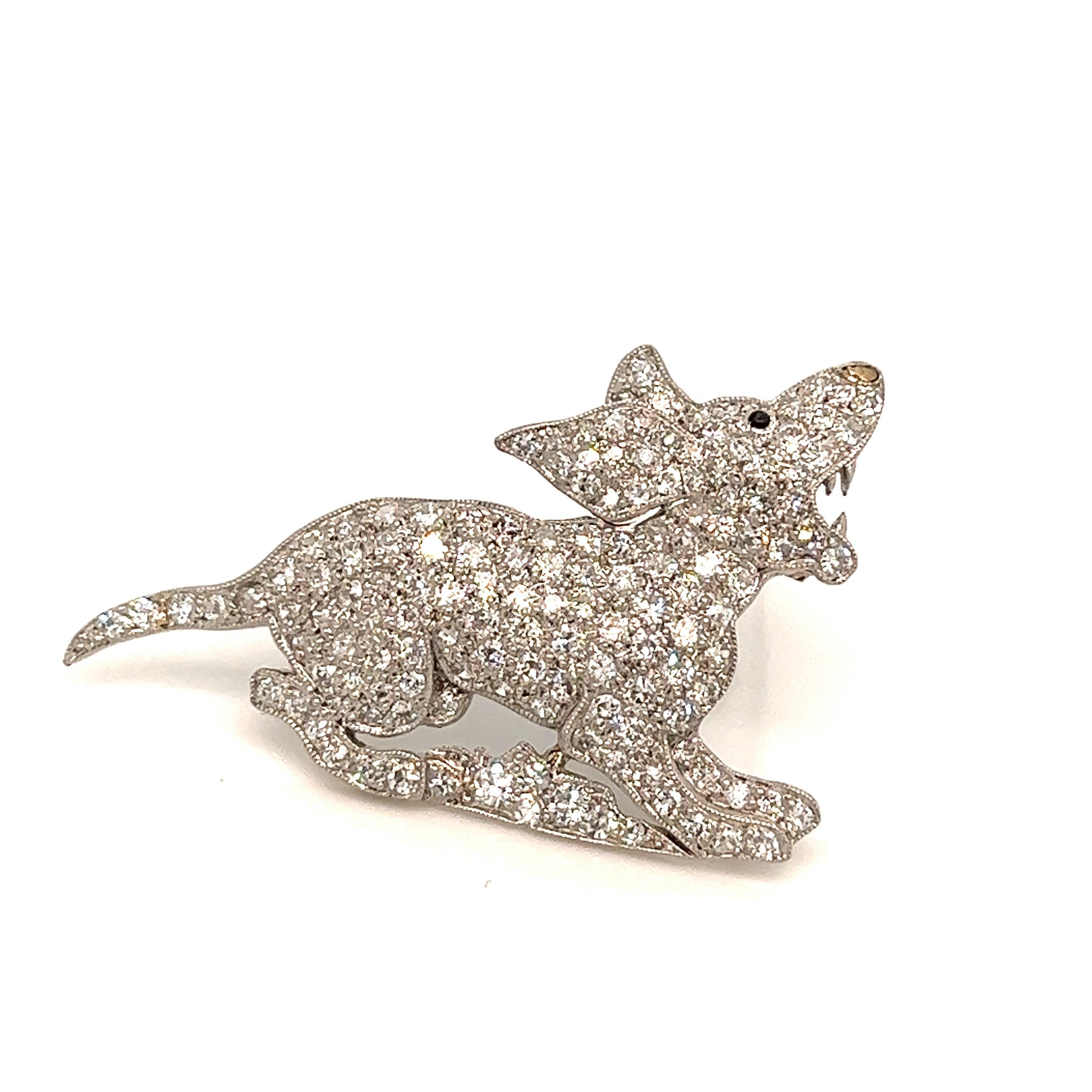 Platinum diamond dog brooch, circa 1930s

Howling dog set with full- and single-cut diamonds, with millegrain accents; platinum

Size: width 1.44 inch, length 1 inch
Total weight: 8.1 grams