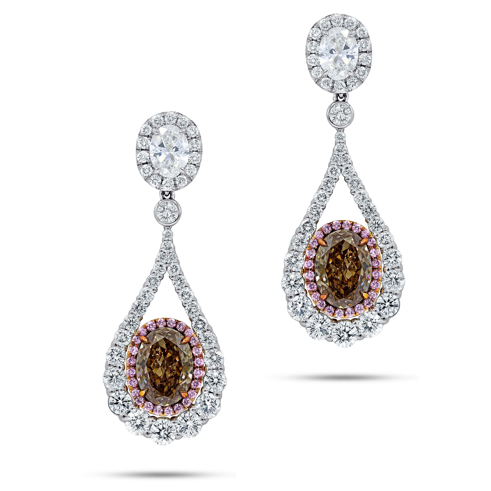 Platinum diamond earrings with 4.02ct fcb si1-si2 of cognac brown diamonds ovals and small pink halo around. gia oval top .70ctfsi2+.71ctfsi2 with small halo 5.40ct of total diamond.  

