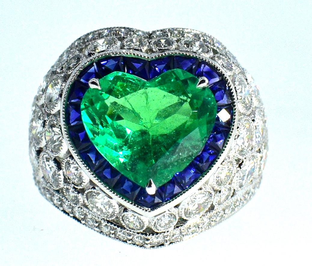 Contemporary Platinum, Diamond, Emerald and Sapphire Ring