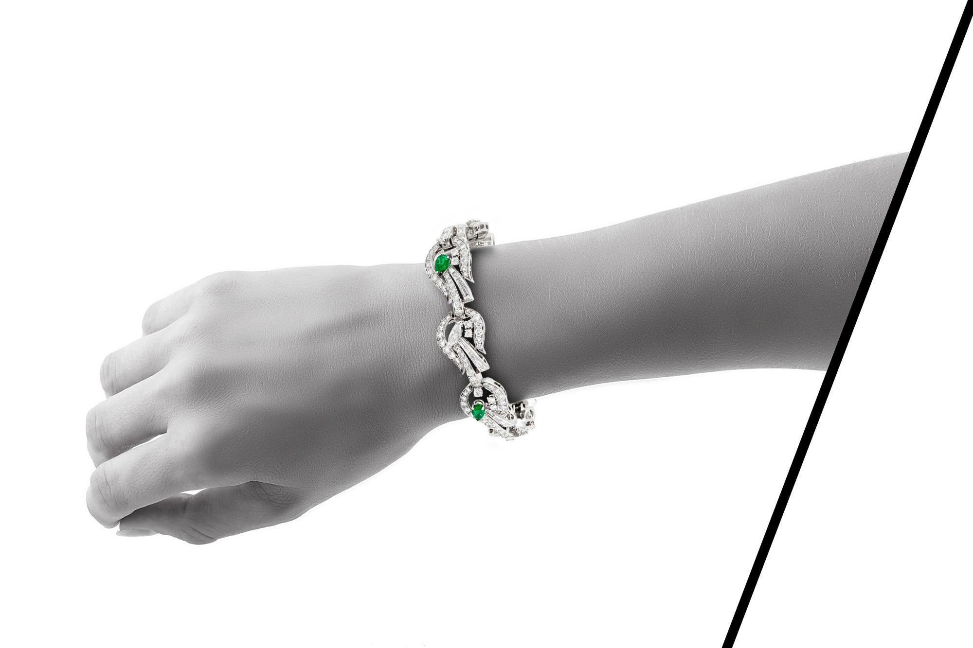 Bracelet, finely crafted in platinum with diamonds weighing approximately a total of 10.00 carat and emeralds weighing approximately a total of 2.00 carat. Circa 1950's.