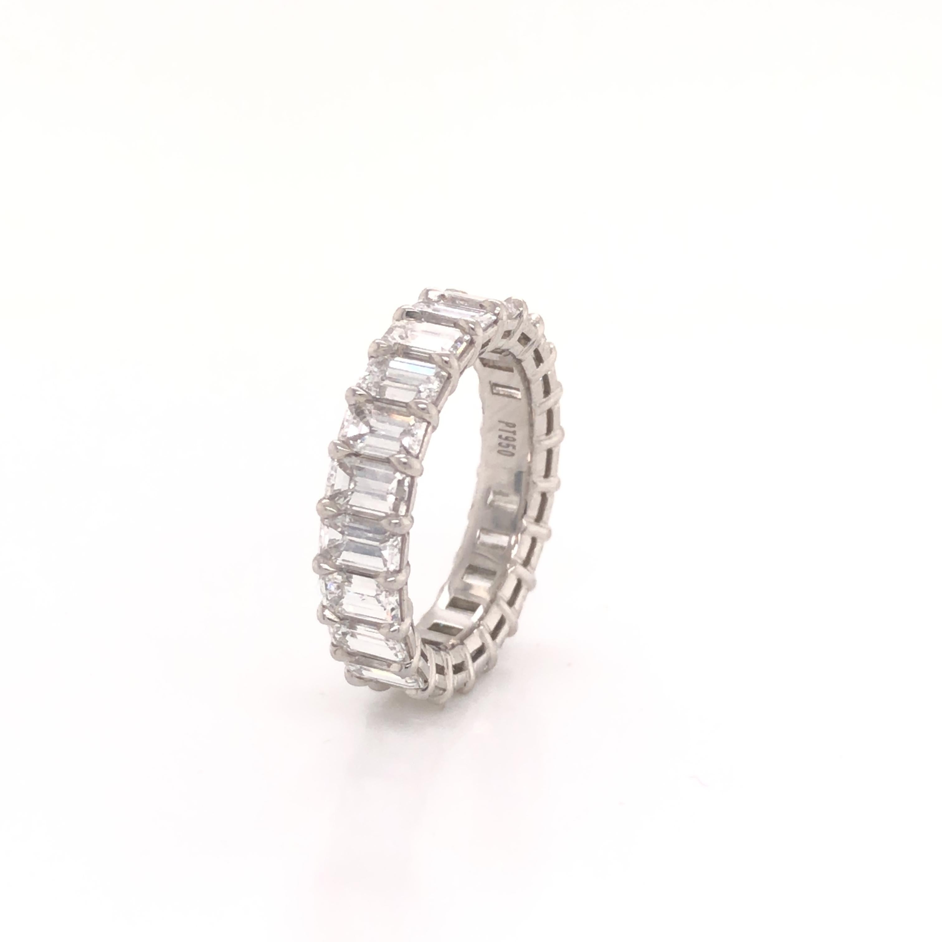 Amazing eternity band crafted in platinum. This gorgeous eternity band is set with emerald cut diamonds 22 in total. The ring displays a 5.40 tcw. Each diamond in this ring weigh approximately 0.25 ct, all diamonds are VVS- VS and shows F-G color.