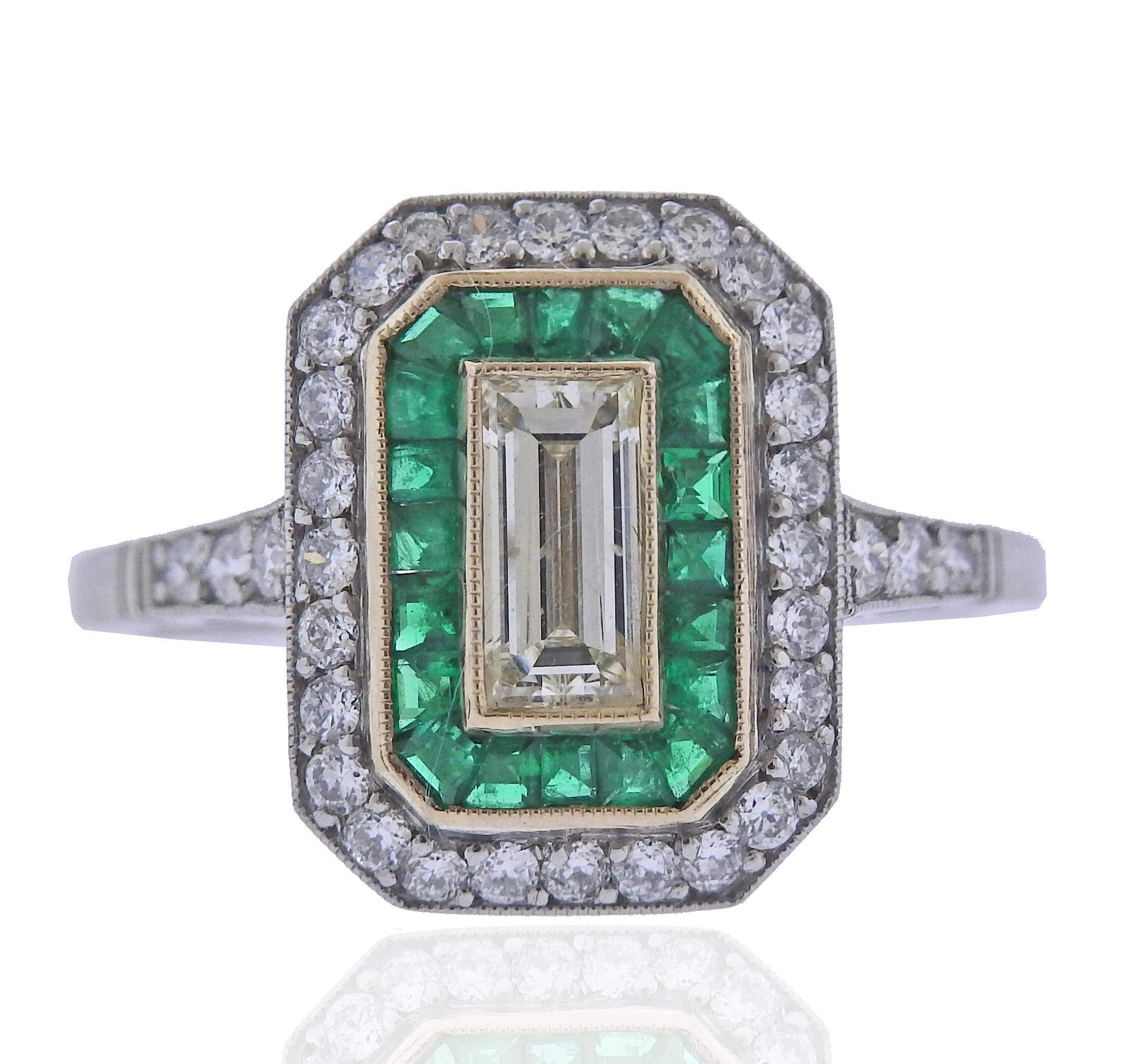 Platinum engagement ring with emeralds and approx. 1.03ctw in diamonds (center is approx. 0.63ct). Ring size 8 (EU 57), top is 15 x 11.5mm. Weight 4 grams. 