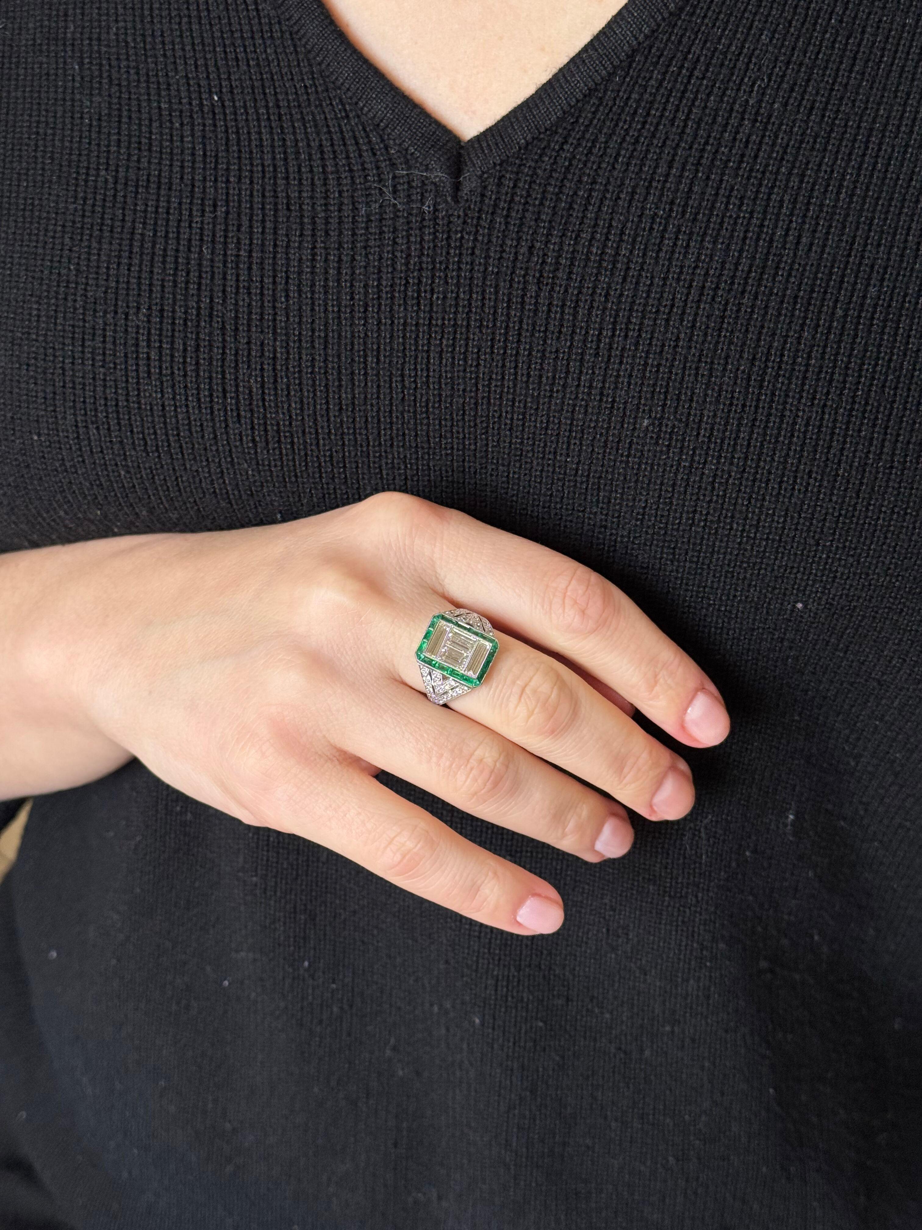 Exquisite platinum ring, set with emeralds and approx. 2.00ctw total diamonds ( center 2 emeralds and two baguette diamonds total approx. 1.50ctw Si1-/Si2/GH). Ring size 7, top is 15.5mm wide. Tested plat, not marked. Weight - 7.8 grams. 