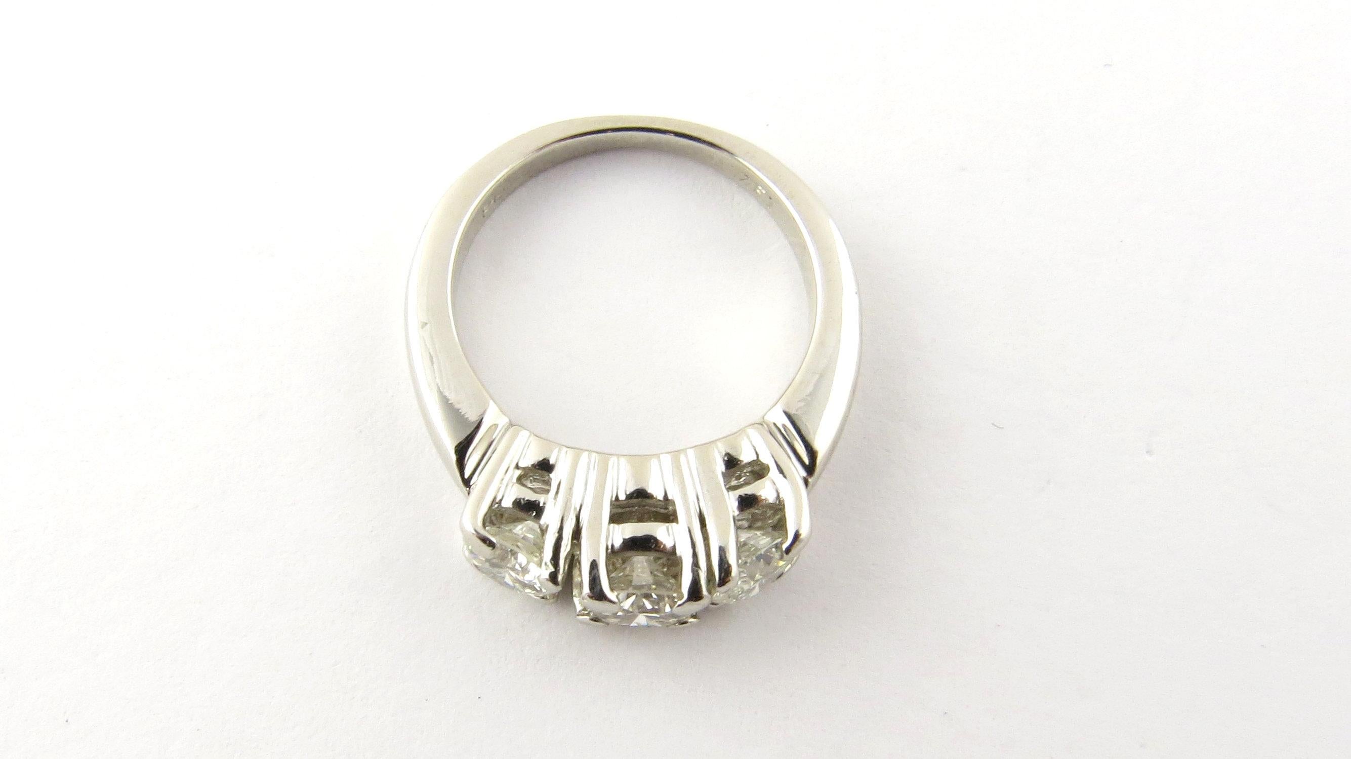 Vintage Platinum Diamond Engagement/Anniversary Ring Size 4.75- 
This elegant anniversary/engagement ring features three round brilliant cut diamonds (.29 ct., .36 ct., .28 ct.) set in classic platinum. Shank measures 2 mm. 
Approximate total