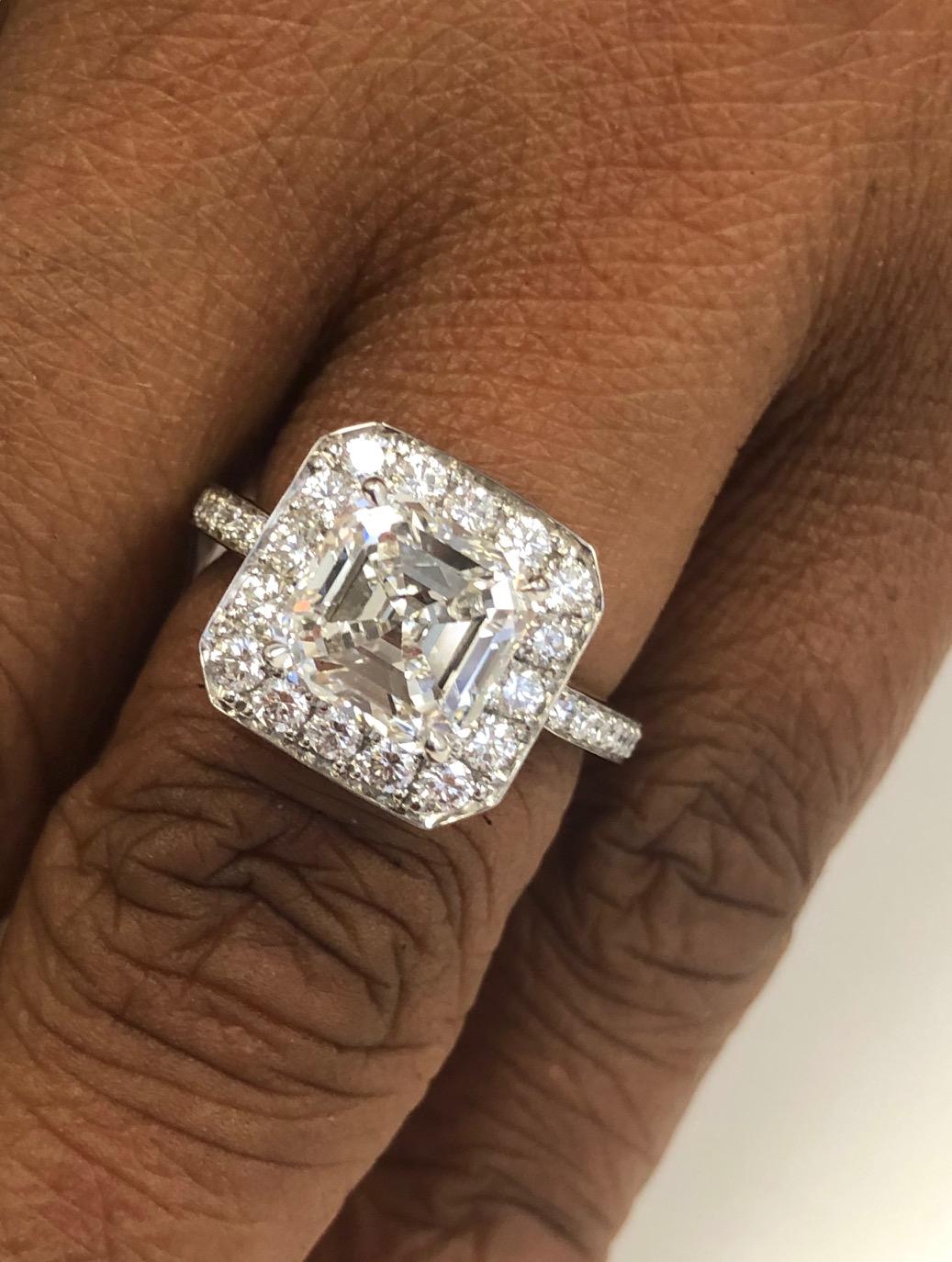 Excellent quality Platinum Diamond Ring, set with a fine Asscher Cut center Diamond 3.01 carats, FVS1 with GIA report and 34 round diamonds 0.80 carats.

We design and manufacture all our jewelry in our workshop, located in New York City's diamond