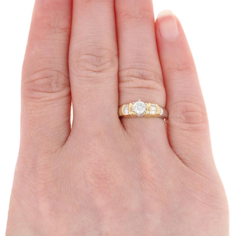 These rings are a size 4 1/2.

Metal Content: 900 Platinum & 18k Yellow Gold

Stone Information: 
Natural Diamonds  
Clarity: SI2 (solitaire); SI1 - SI2 (accents) 
Color: J (solitaire); I - J (accents)
Cuts: Round Brilliant (solitaire) & Baguette