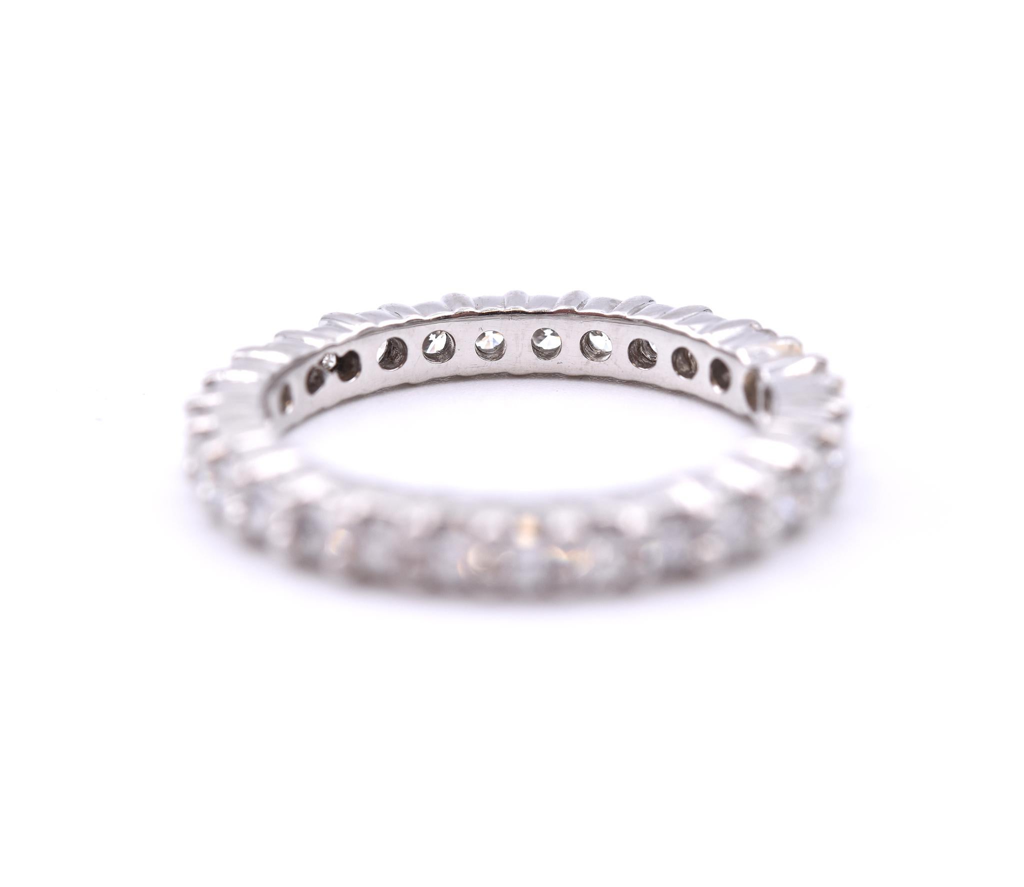 Designer: custom
Material: platinum 
Diamonds: 29 round brilliant cut = 1.75cttw
Color: G
Clarity: VS2
Size: 8.5 (please allow two additional shipping days for sizing requests)  
Dimensions: ring measures 2.9mm in width
Weight: 6.30 grams