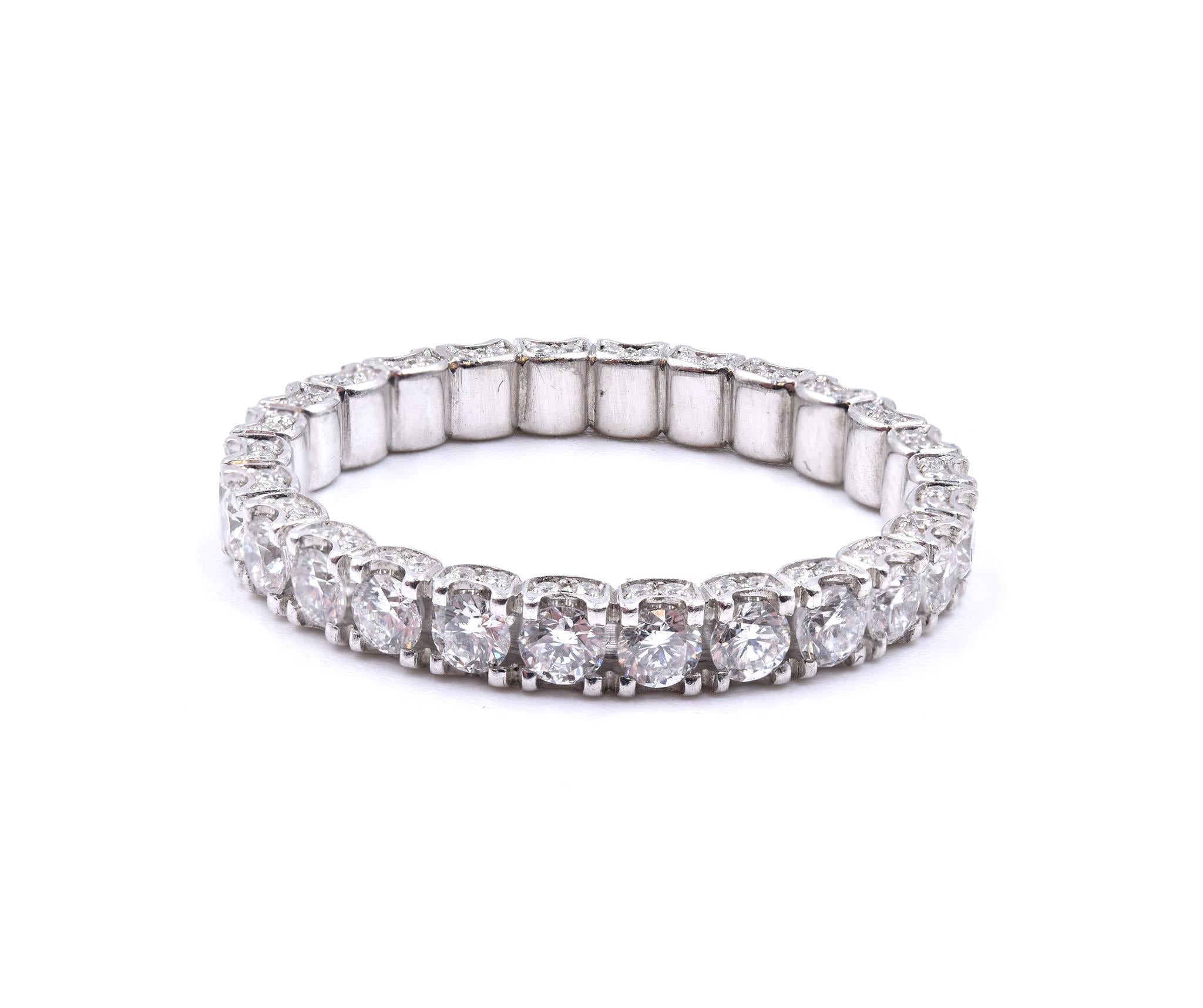 Material: Platinum
Diamonds: 26 round brilliant cut = 1.04cttw
Color: G 
Clarity: VS1
Diamonds: 104 round cut = .54cttw
Color: G 
Clarity: VS
Ring Size: 6 (please allow up to 2 additional business days for sizing requests)
Dimensions: band measures