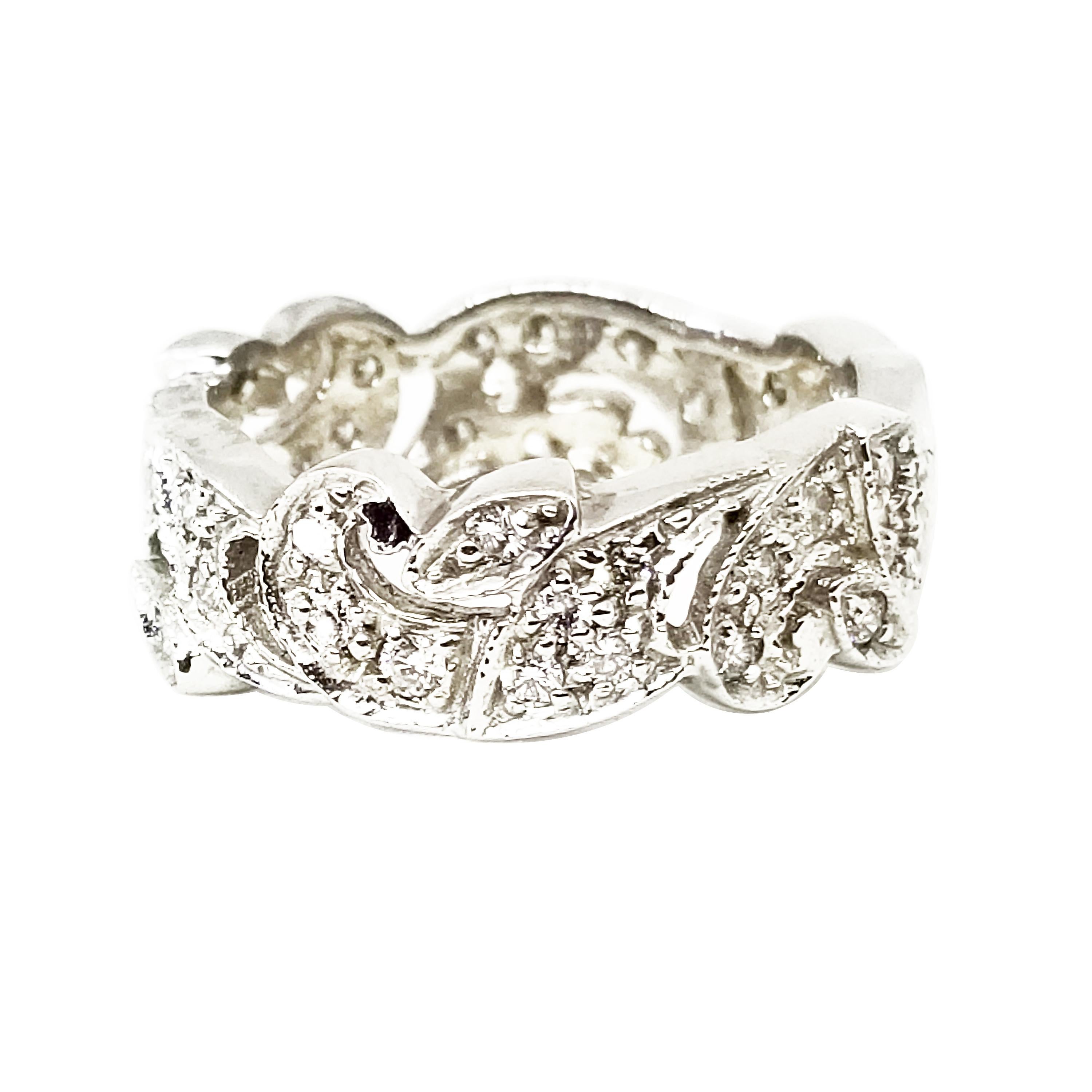 This Platinum Eternity Ring features Round Brilliant Diamonds of 0.70 Carat total weight, G-H Color and Si1 Clarity, and are bead set entirely around the ring. The Intricate Band features an open work swirl design. A Unique Wedding, Anniversary or