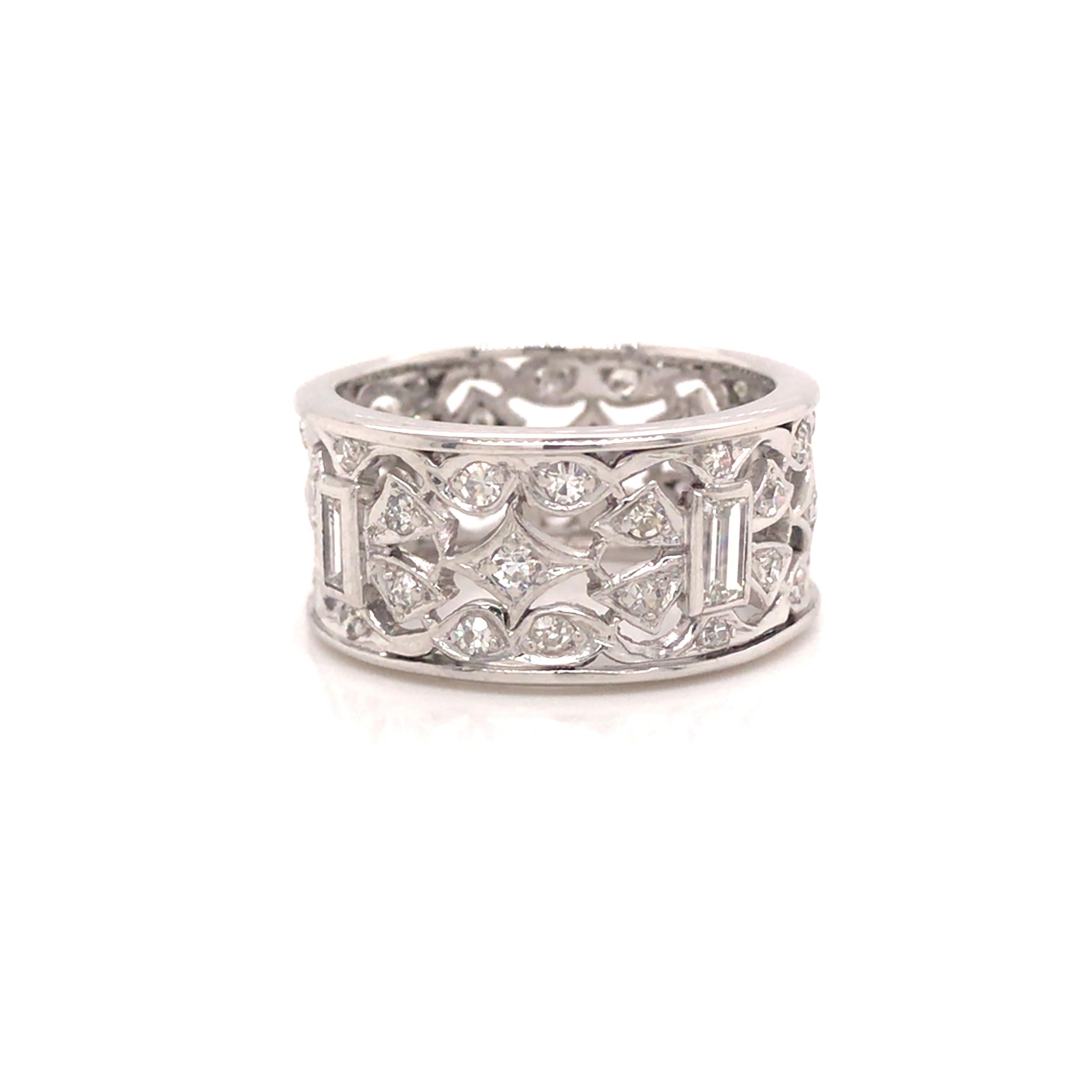 Platinum Diamond Fashion Band.  (48) Round Brilliant Cut and Baguette Diamond weighing 1.35 carat total weight, G-H in color and VS-SI in clarity are expertly set.  The Ring measures 7/16 inch in width.  Ring size 7 1/2. 10.10 Grams.