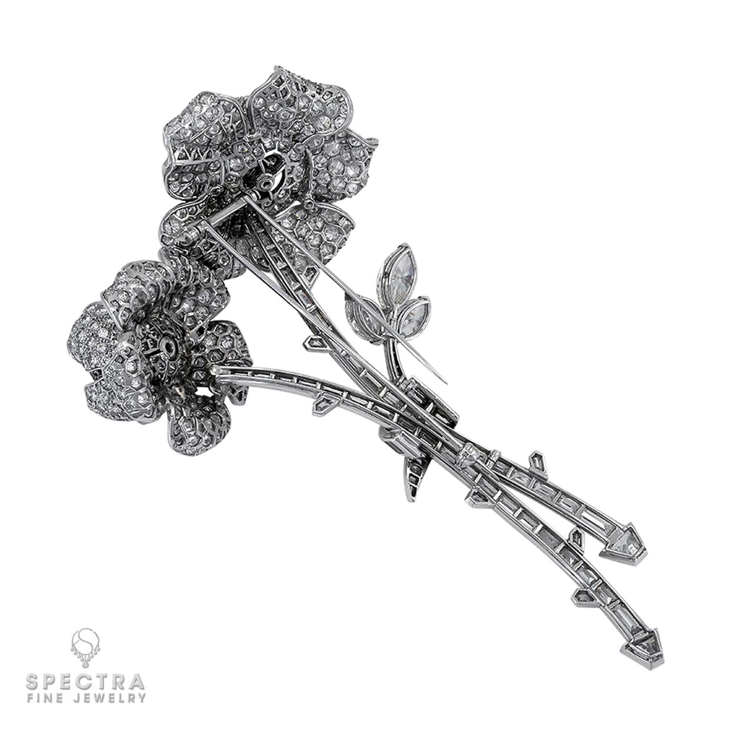 Magnificent flower brooch embellished with diamonds and made in platinum.
Designed as two flowers set 