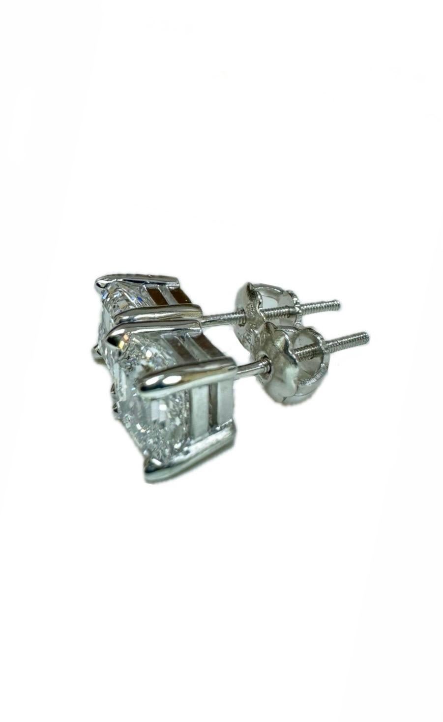 DeKara Designs Classic

Metal- 95% Platinum 5% Iridium.

Stones- 2 GIA Certified 
Asscher Cut Diamonds, 1 D Color VS2 Clarity 1.06 Carats, 1 E Color VS2 Clarity 1.11 Carats. Both Diamonds are Laser Insribed.

Earrings Come With GIA Diamond