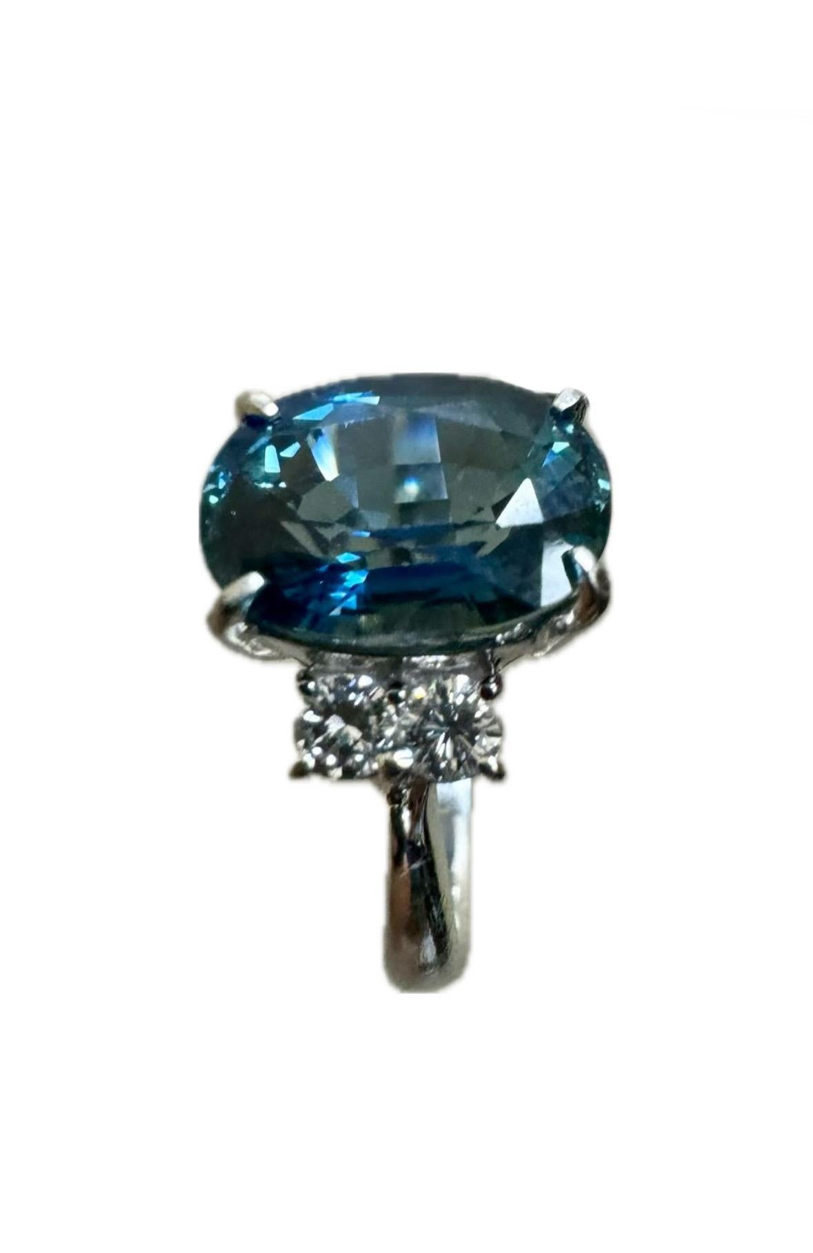DeKara Design Collection

Metal- 90% Platinum, 10% Iridium.

Stones- GIA Certified Heat Treated Thai Peacock Blue Sapphire 4.46 Carats, Four Round Diamonds F-G Color VS2-SI1 Clarity 0.28 Carats.

GIA Report Number 5231389497

Size- 5 1/2. FREE