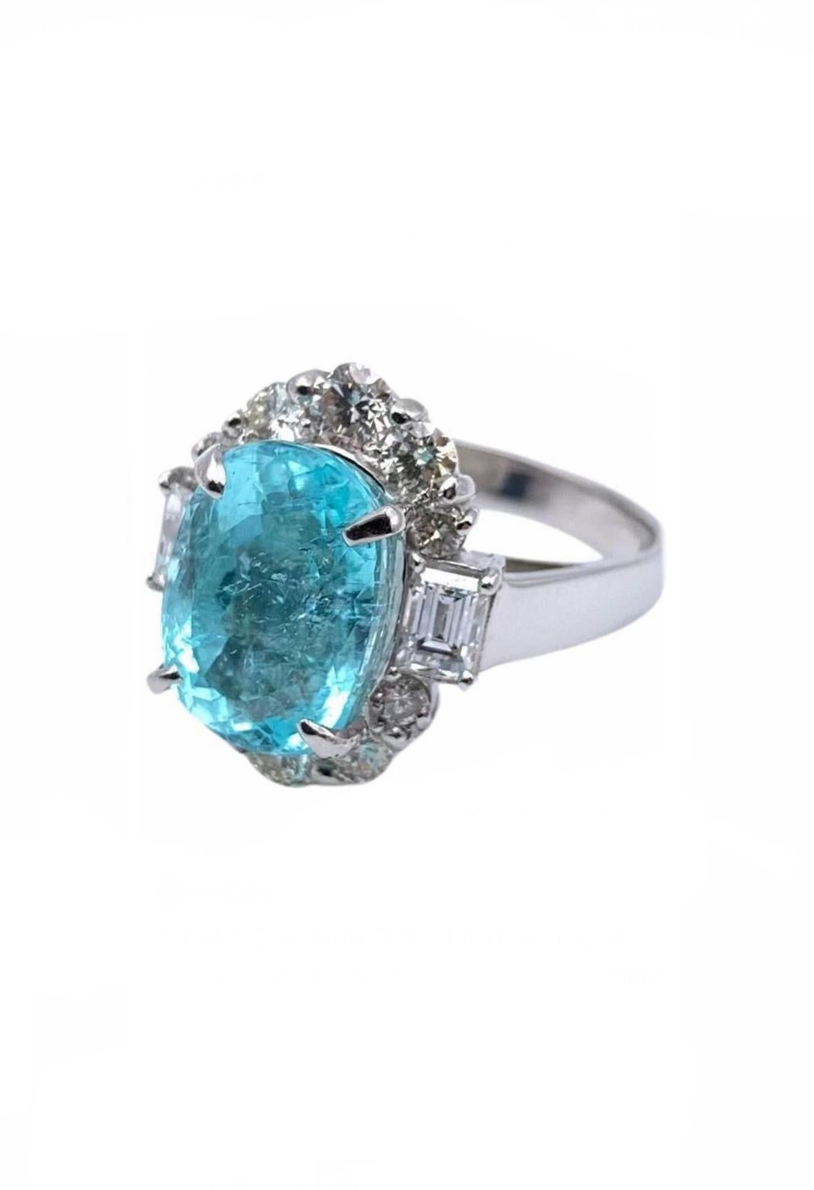 
DeKara Design Collection 

Metal- 90% Platinum, 10% Iridium. 

Stones- 1 GIA Certified Oval Blue-Green Paraiba Tourmaline 4.11 Carats, 2 Emerald Cut Diamonds, 10 Round Diamonds, H Color VS1-VS2 Clarity 1.01 Carats.

GIA Certificate Number