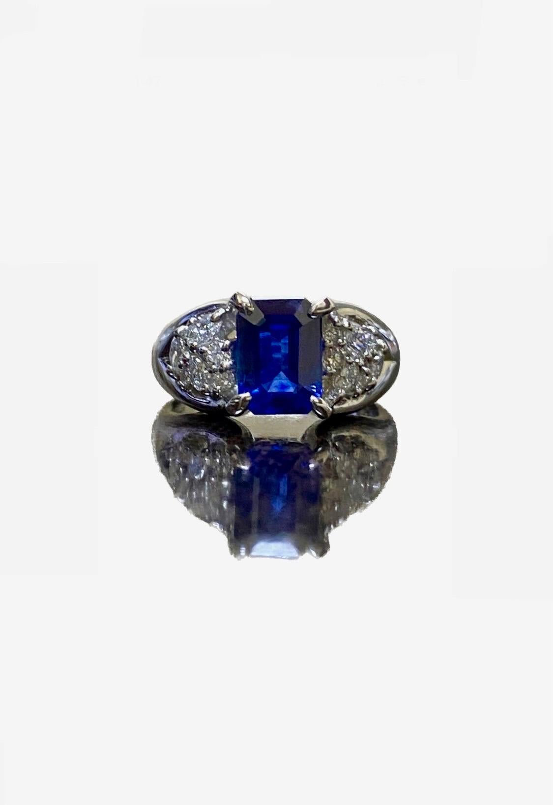 DeKara Design Collection

Metal- 90% Platinum, 10% Iridium.  

Stones- 1 GRS Certified Heat Treated Emerald Cut Blue Sapphire, 12 Round Diamonds, 6 Marquise Diamonds F-G Color VS2 Clarity 0.46 Carats.

GRS Report Number GRS2017-118196

Size- 5 3/4. 