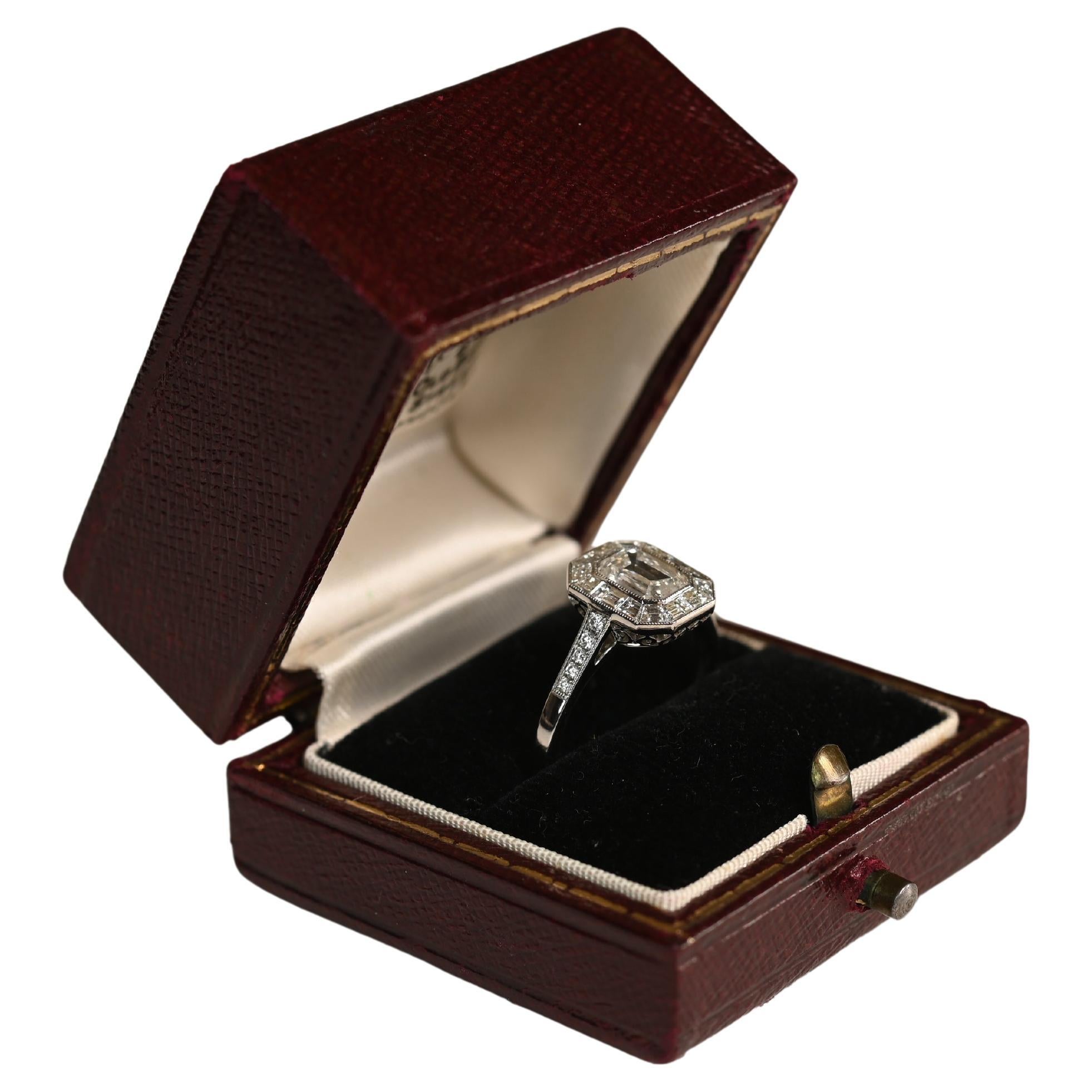 Platinum and Emerald Cut Engagement Ring. GIA Diamond Baguette Halo Ring I VS2