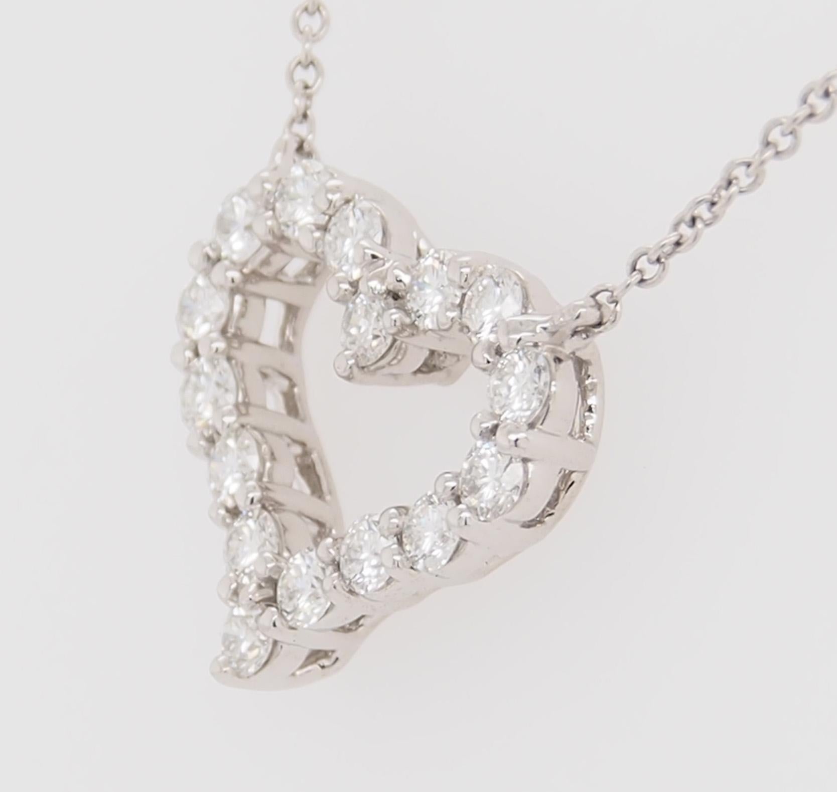 A classic style Tiffany and Co Heart Pendant. (16) Round Brilliant Cut Diamonds E-F in color, VS in clarity, 0.54 total weight are expertly set in Platinum. The necklace is 17 inches long, the heart is 5/8 inch wide, 1/2 inch in height and weighs