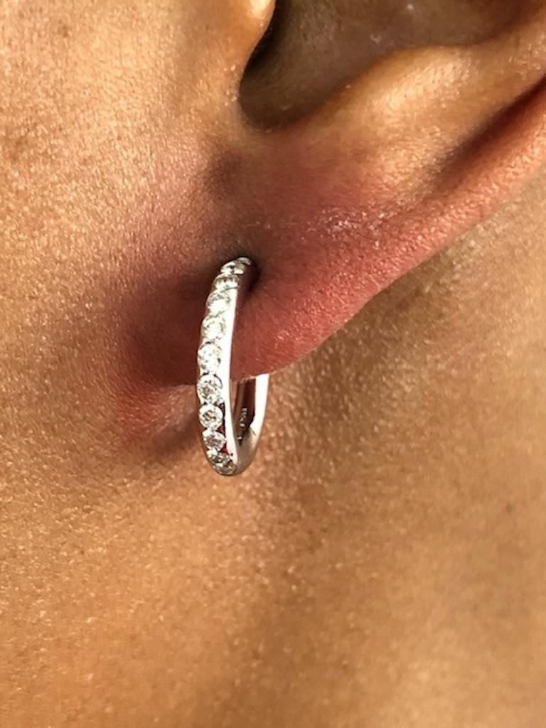 A perfectly round diamond circle hoop earrings, made in platinum, set with 22 round diamonds 0.46 carats.
Hoop diameter: 1.6 cm ( 5/8