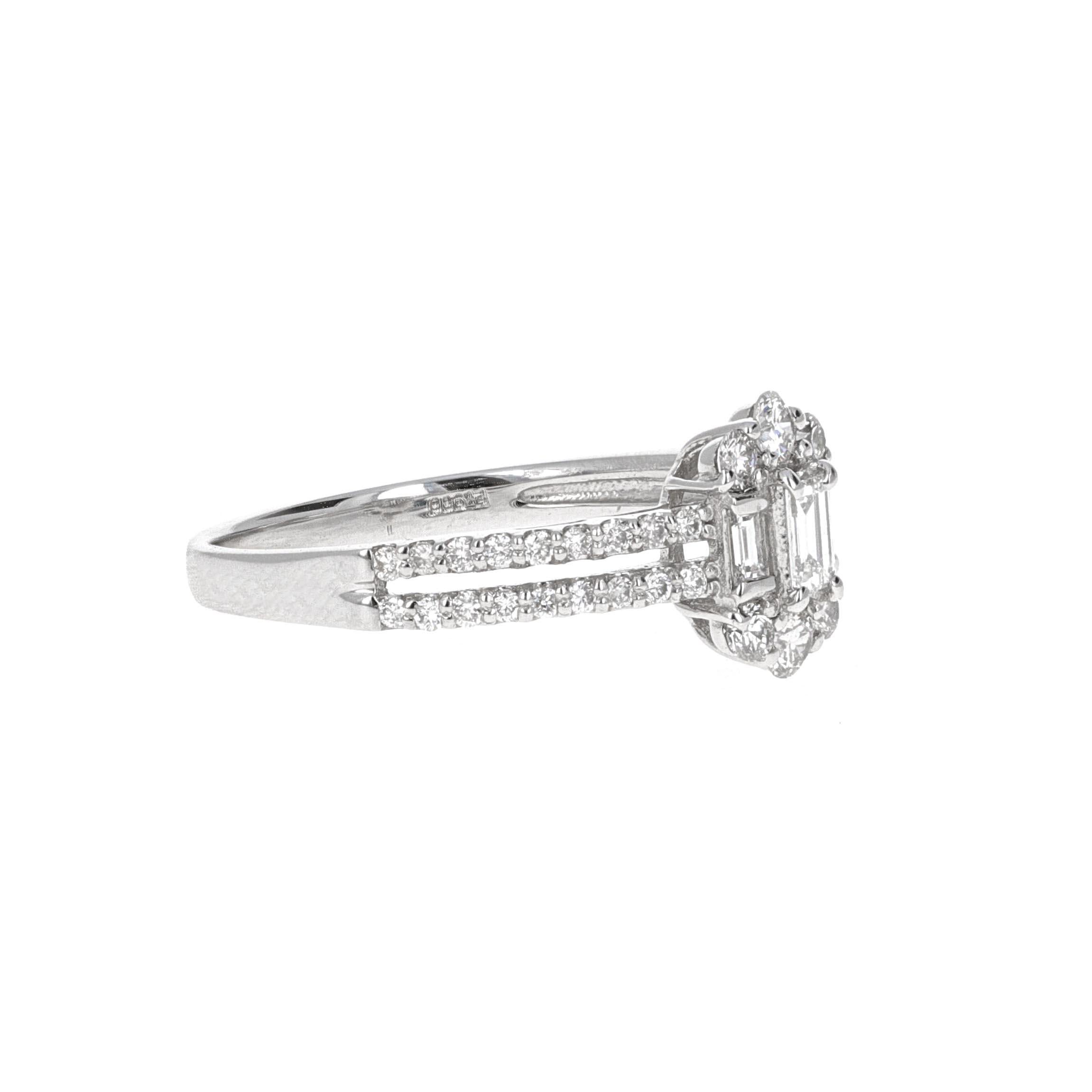 Beautiful, dainty diamond illusion ring. The ring is made in platinum and has en estimated 0.50 carats total weight in diamonds. The diamonds are white in color and eye clean. The ring is made up of round brilliant diamonds and baguette shape