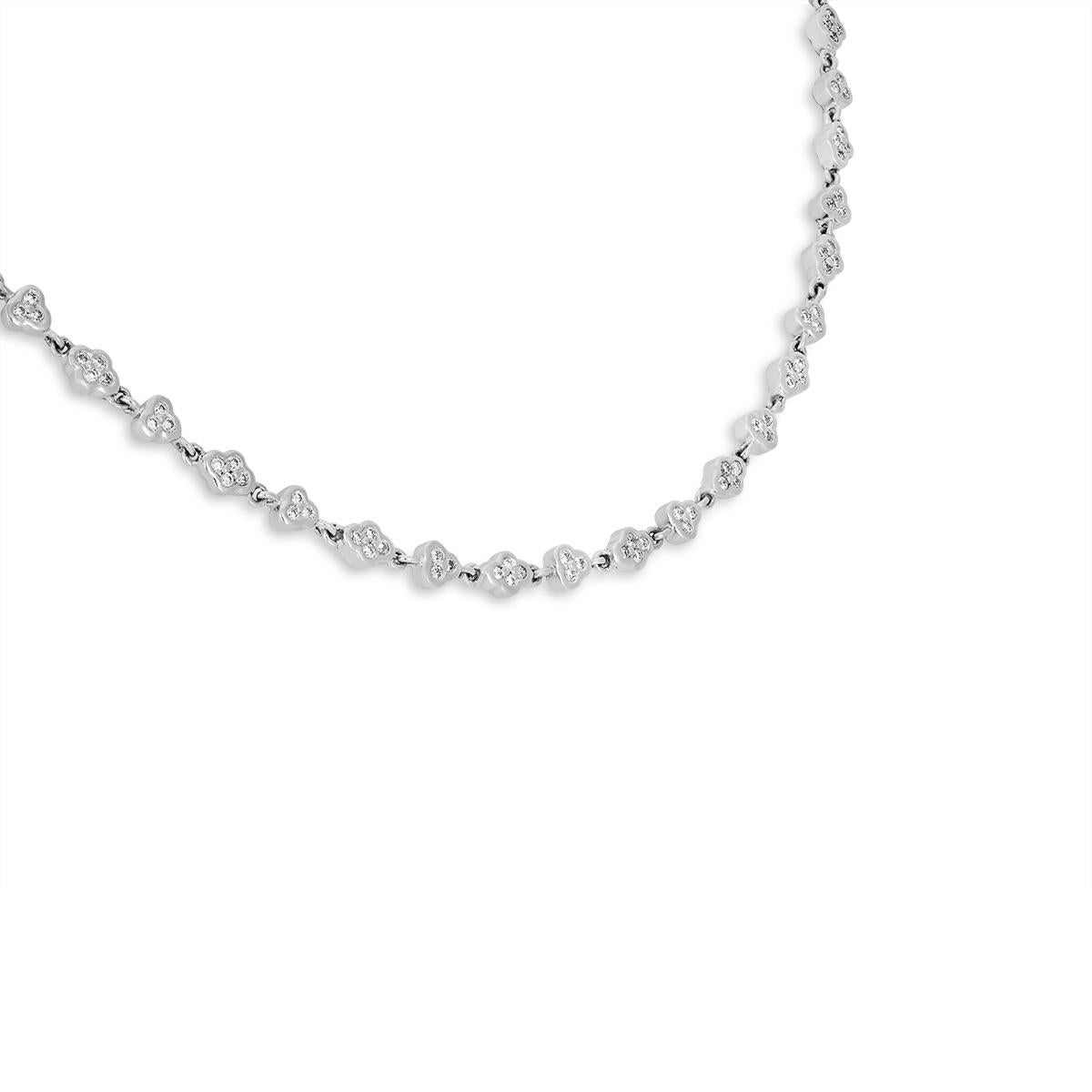 An elegant platinum diamond necklace. The necklace features stations alternating between 3 and 4 round brilliant cut diamonds with a high polish surround. There are 406 round brilliant cut diamonds set throughout the chain with an approximate total