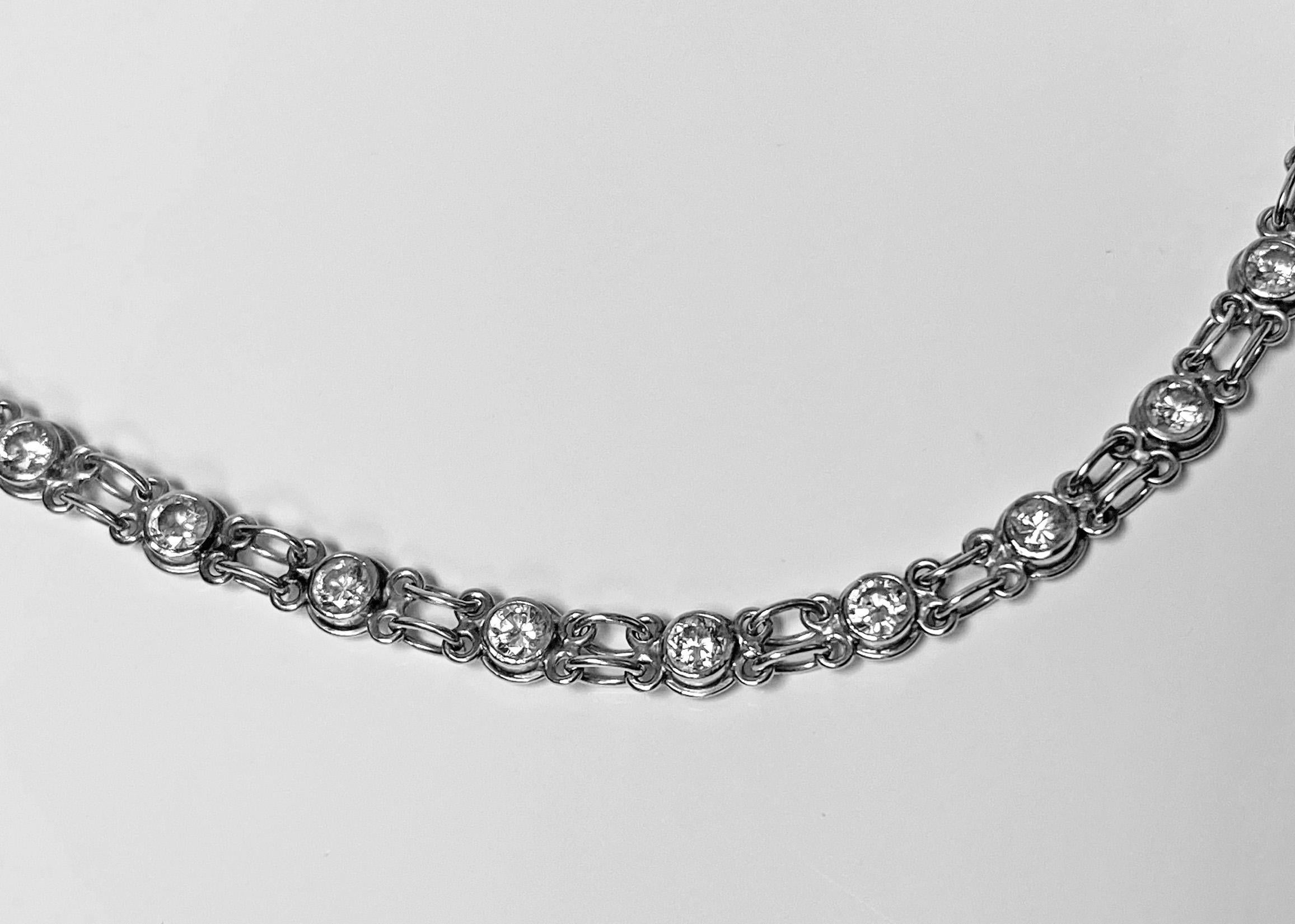 Very finely made Platinum and Diamond Necklace, C.1930. The necklace with alternate intertwining loop and diamond milligrain set links; 58 full cut diamonds, approximately 4.06 ct total diamond weight, average SI clarity, average I-J colour. Length: