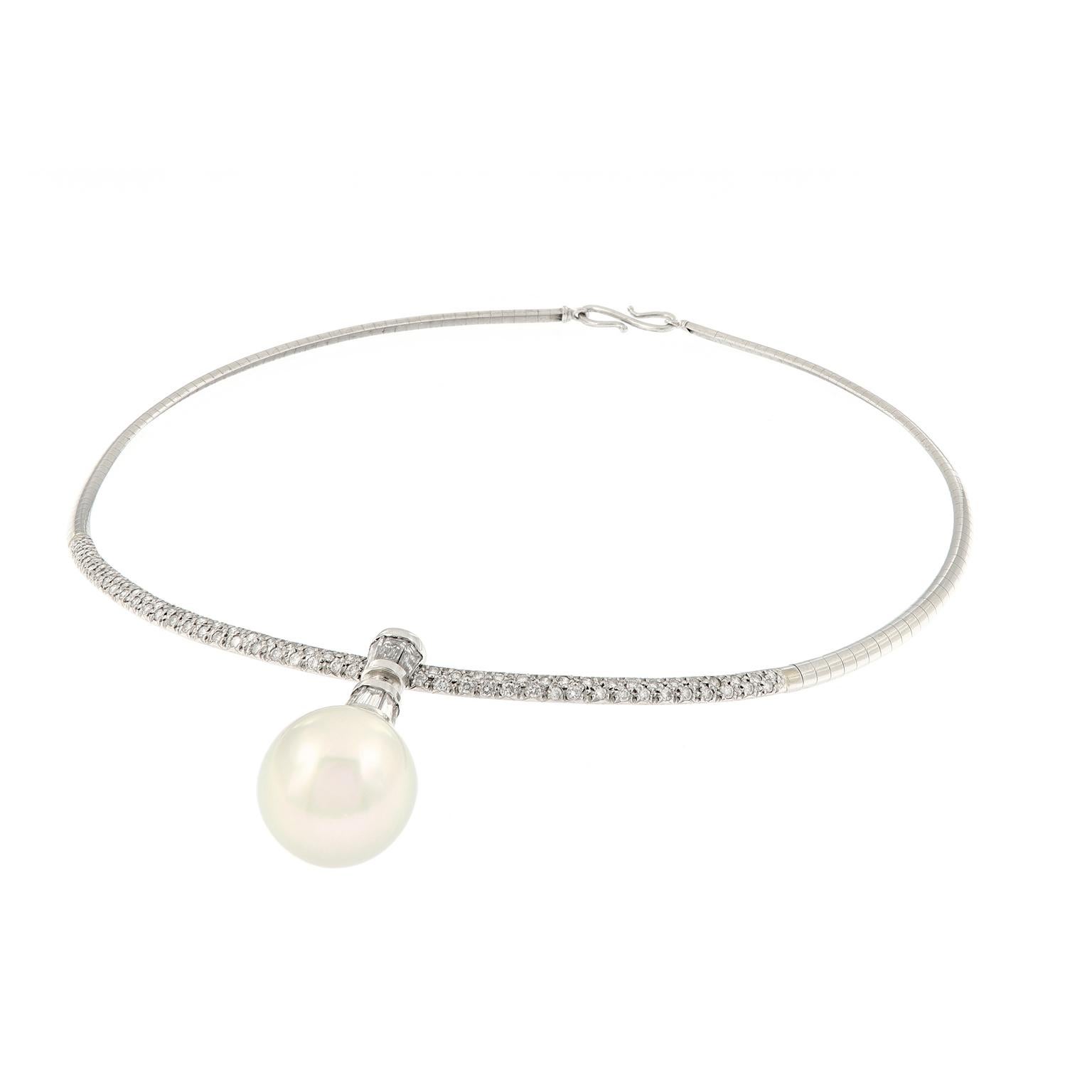 The beautiful platinum domed Omega necklace is accented with pave set diamonds and features a white South Sea cultured pearl pendant. Pearl pendant is detachable and is capped with baguette diamonds. This necklace is 15.5 inches long and in