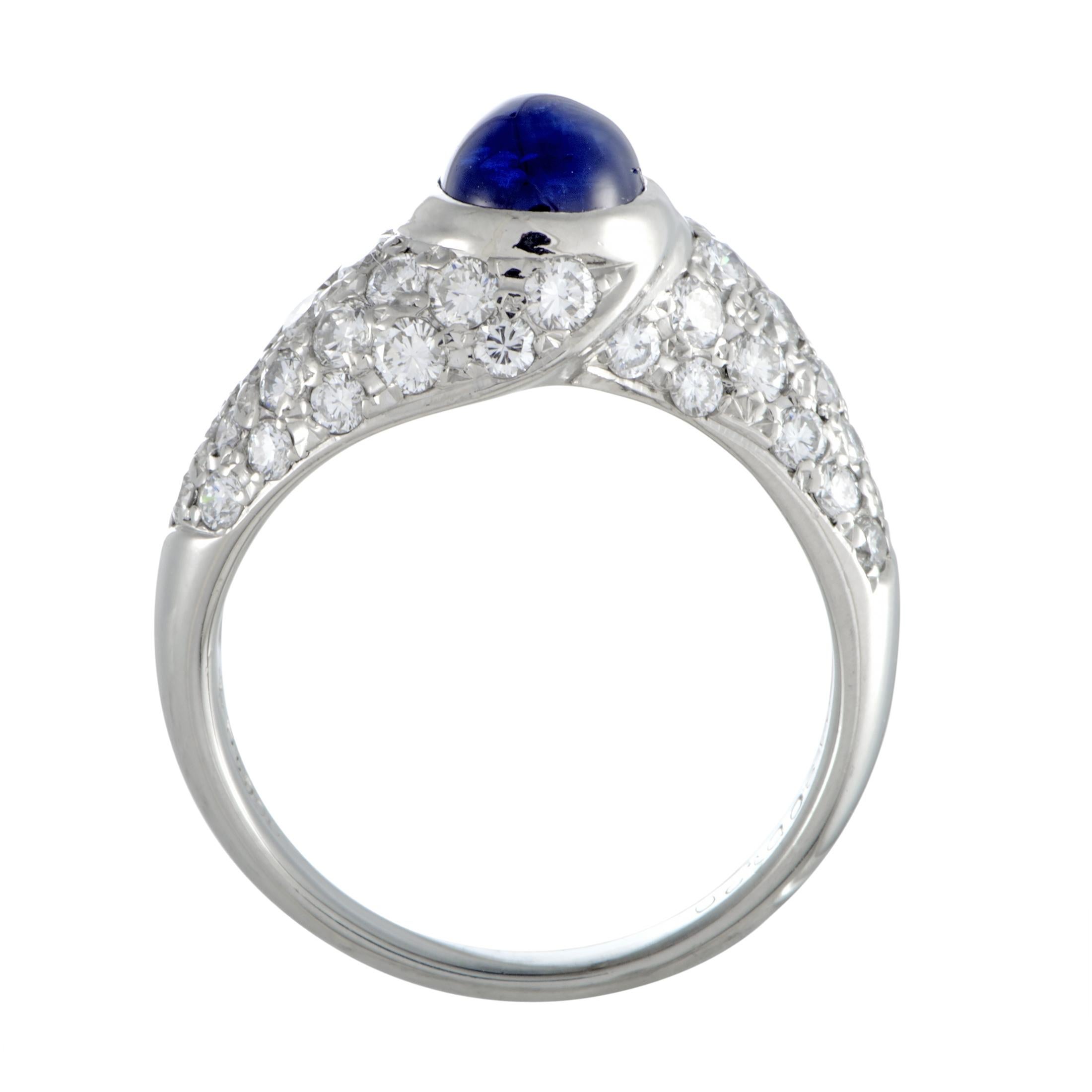 Featuring an exceptionally elegant design that is presented in luxurious platinum and topped off with resplendent gems, this beautiful ring offers a splendidly refined look. The ring is expertly set with a striking sapphire that weighs 1.80 carats
