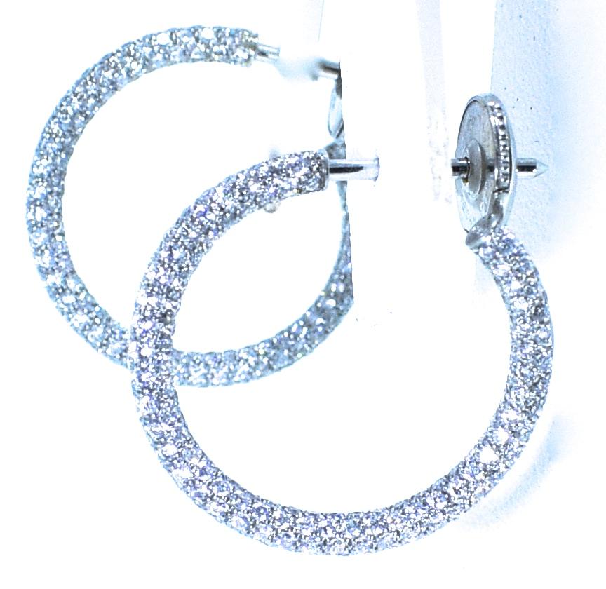 Platinum diamond small hoops with 350 brilliant cut diamonds equalling approximately 1.4 cts.  These hoops are completely paved with diamonds - both inside and outside.  The diamonds are  are all well pave set, near colorless, H, and very slightly