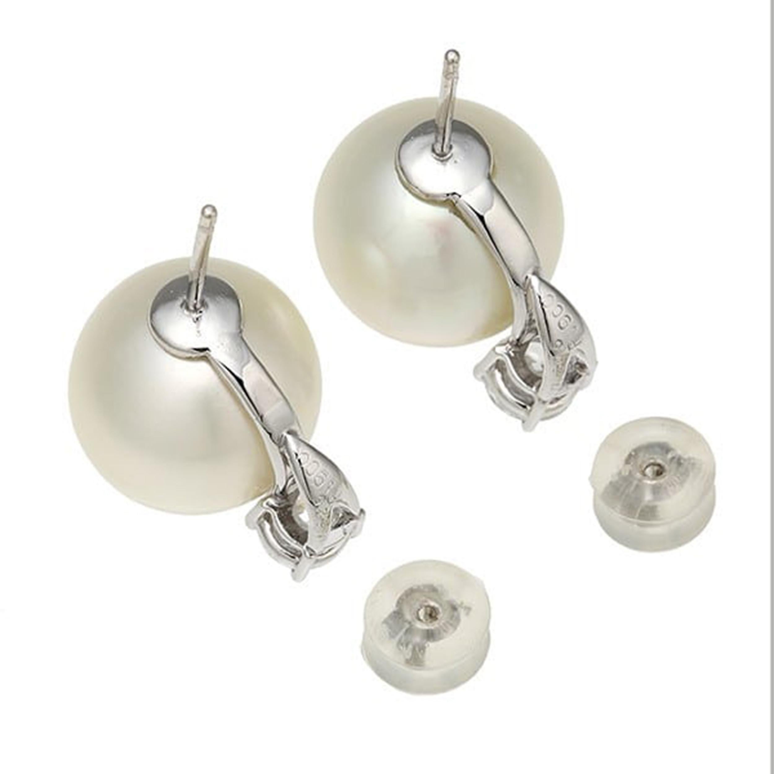 Elevate your jewelry collection with these exquisite platinum diamond pearl earrings. Crafted with precision and elegance, these earrings feature stunning pearls measuring approximately 13.6mm in size, complemented by sparkling diamonds. Each