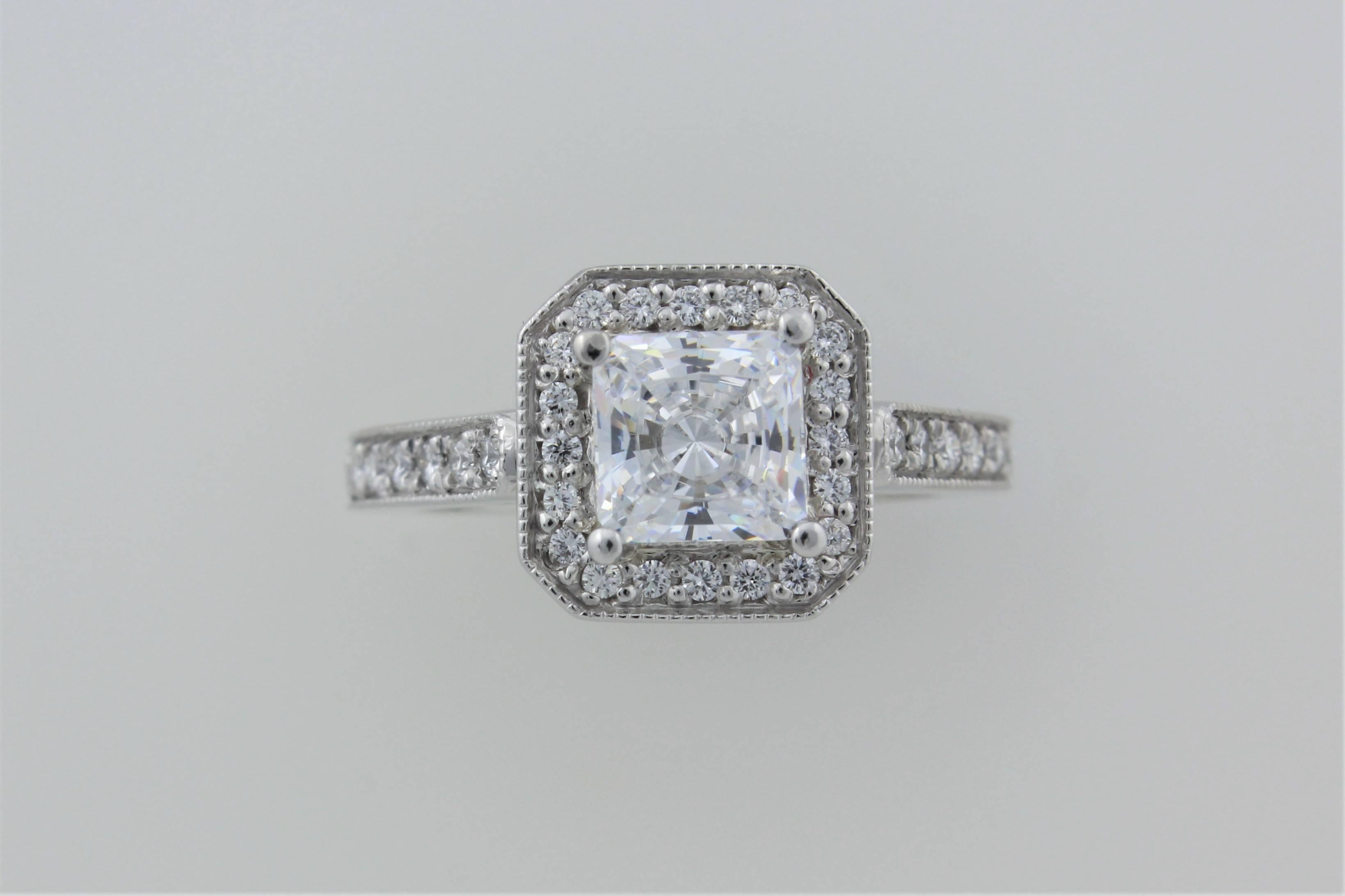 Here is a beautiful platinum Precision Set, halo style, flush fit ring mounting with .35 carats of G-H Color, VS clarity diamonds.  The center is a cubic zirconia so this is a perfect ring to reset your center diamond into a new frame or to wear as