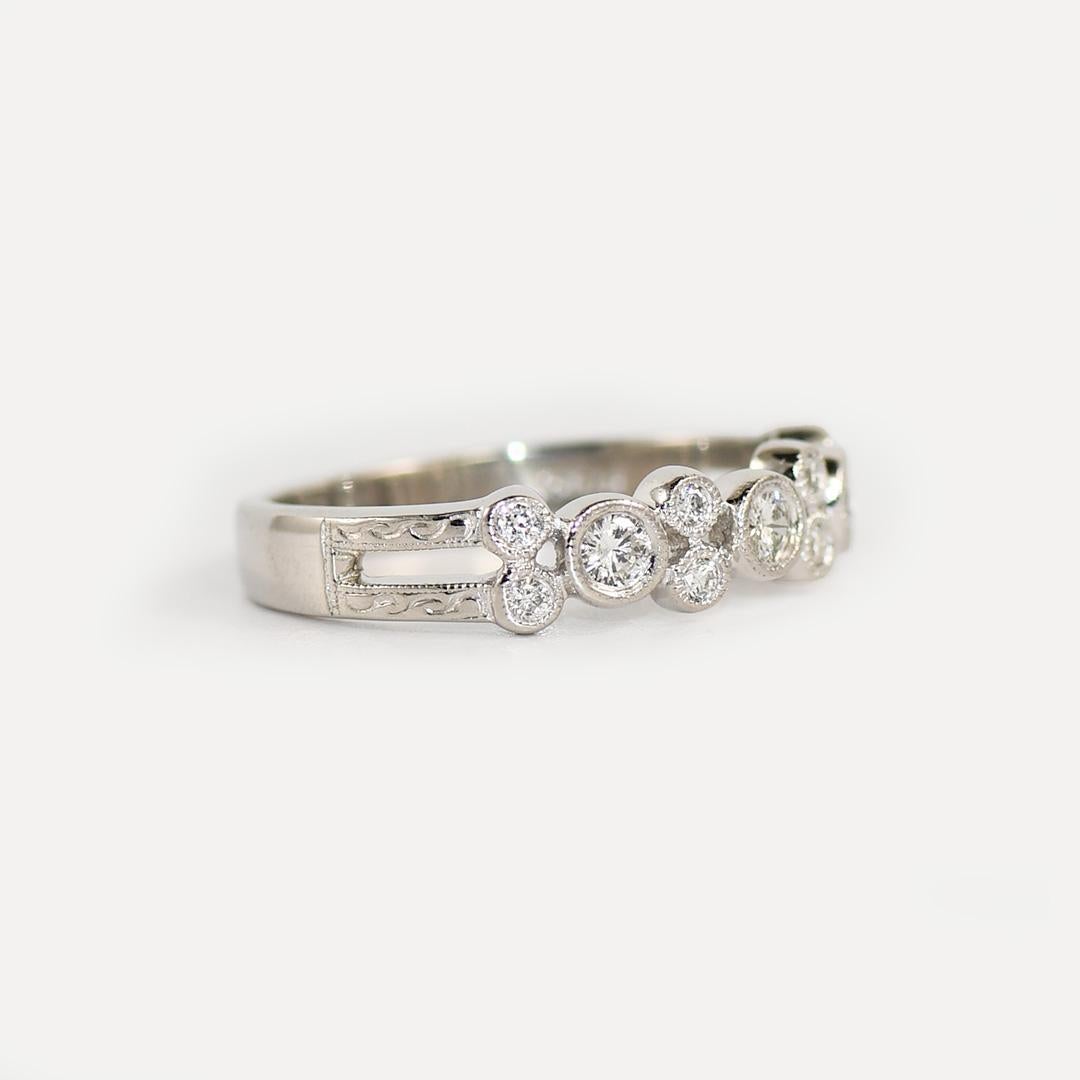 Ladies platinum and diamond ring.
Stamped Pt 950 and weighs 5.8 grams.
The diamonds are round brilliant cuts, .33 total carats, G, H, i, color range, Si clarity.
Attractive metal work around the diamonds.
The top of the ring measures 4 to 5mm