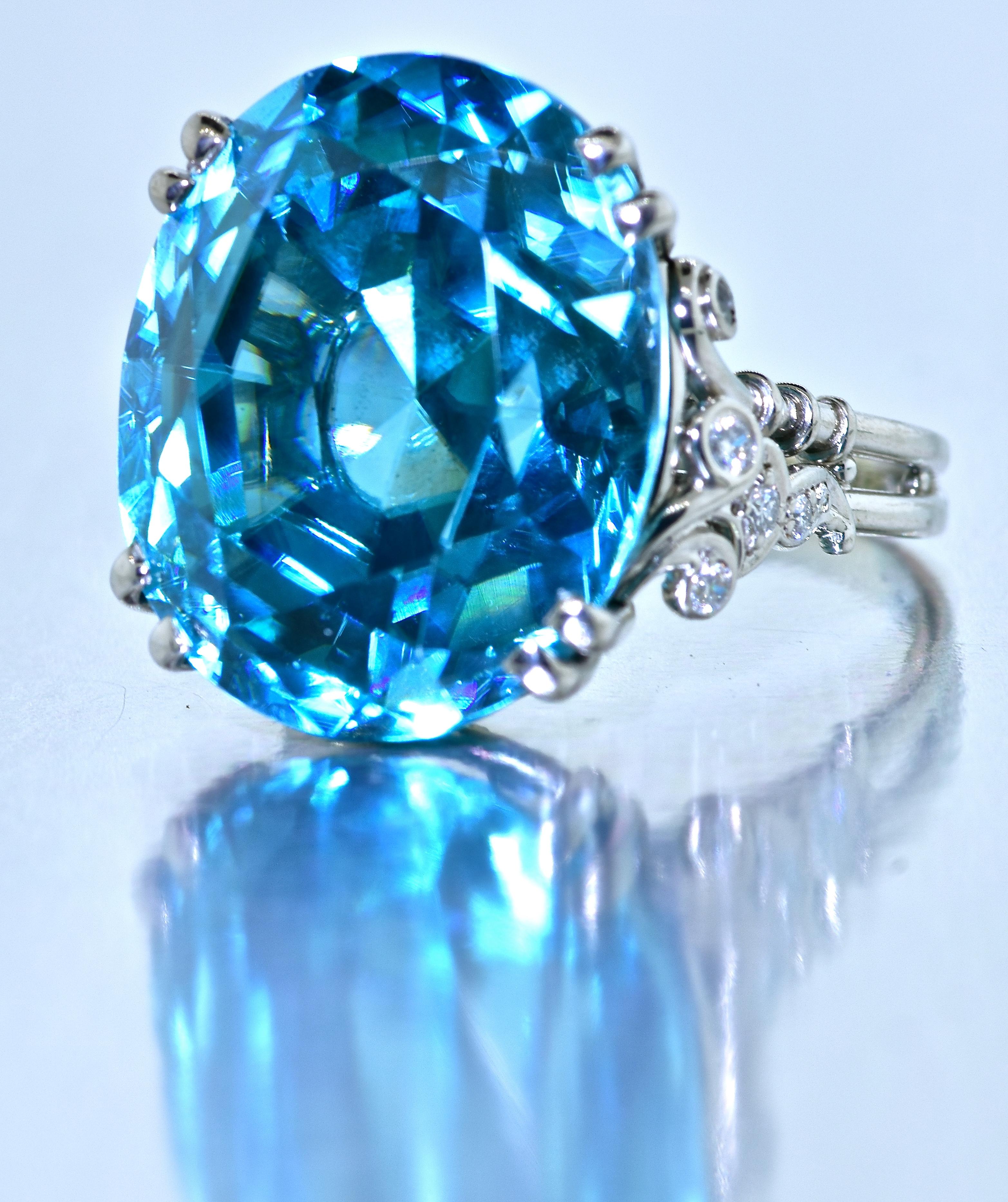 Intense blue natural blue Zircon weighing 32.09 cts. Natural blue zircons are very rare above 15 cts., and very hard to locate.   This center stone is collection quality because, not only its unusually large size, but also its intense pure blue