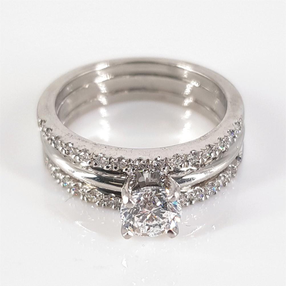 Stunning, beautiful and bold, this ring says it all. Set in platinum and weighing 7.1 grams, this ring features 1 Round Brilliant Cut Diamond (GH vs-si) weighing 0.50carat, and is surrounded by 30 Round Brilliant Cut Diamonds (GH vs-si) weighing