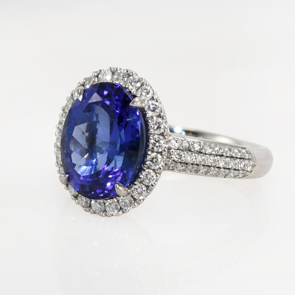 Ladies tanazanite and diamond ring with platinum setting.
Stamped Pt 950 and weighs 6.9 grams.
The tanzanite is a 4.00 carat oval shape, spectacular violet blue color.
The side diamonds are round brilliant cuts, .50 total carats, h, i, j color,