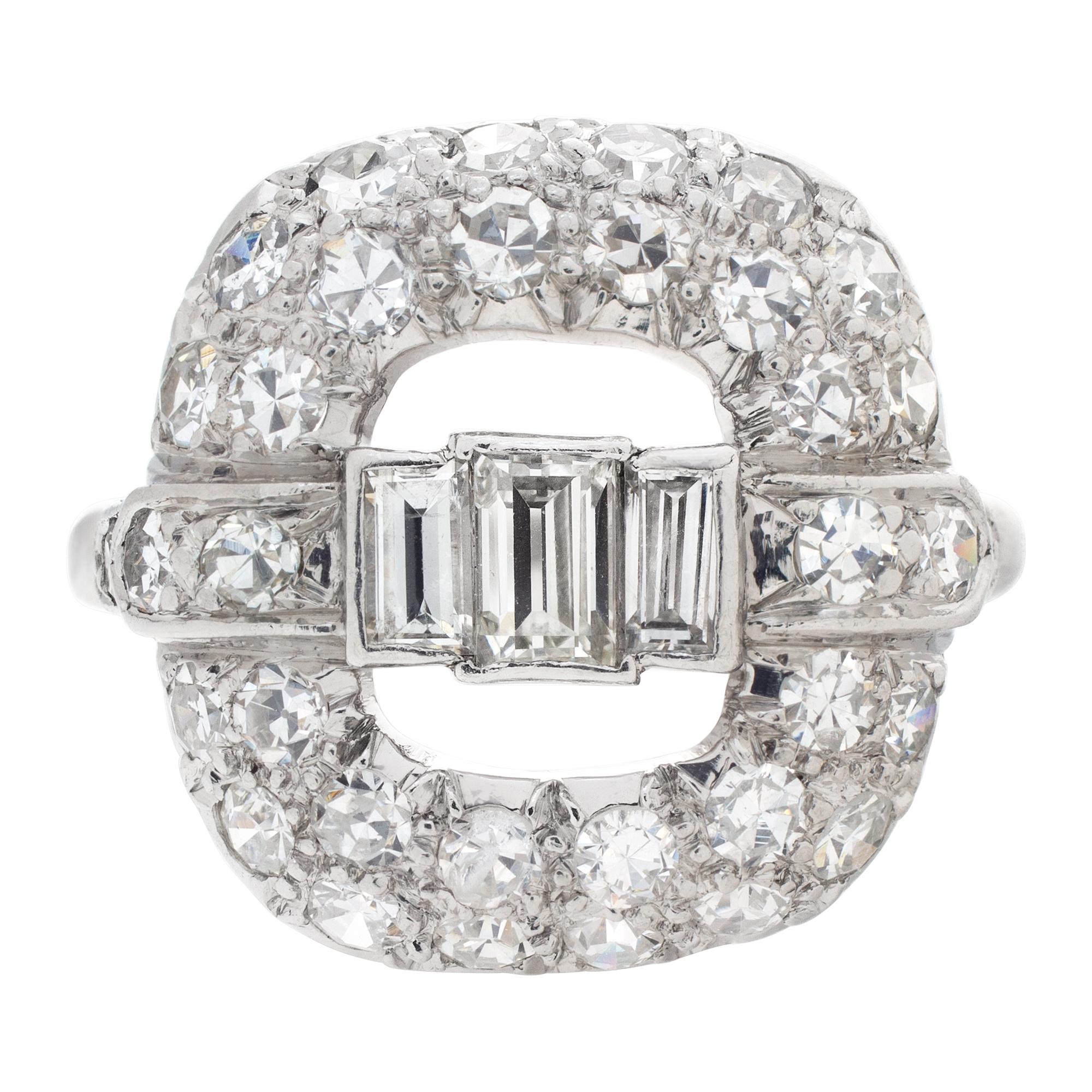 Vintage platinum diamond ring with approximately 0.88 carats in round & baguette diamonds. Size 6.<br /><br />This Diamond ring is currently size 6 and some items can be sized up or down, please ask! It weighs 2.7 pennyweights and is Platinum.
