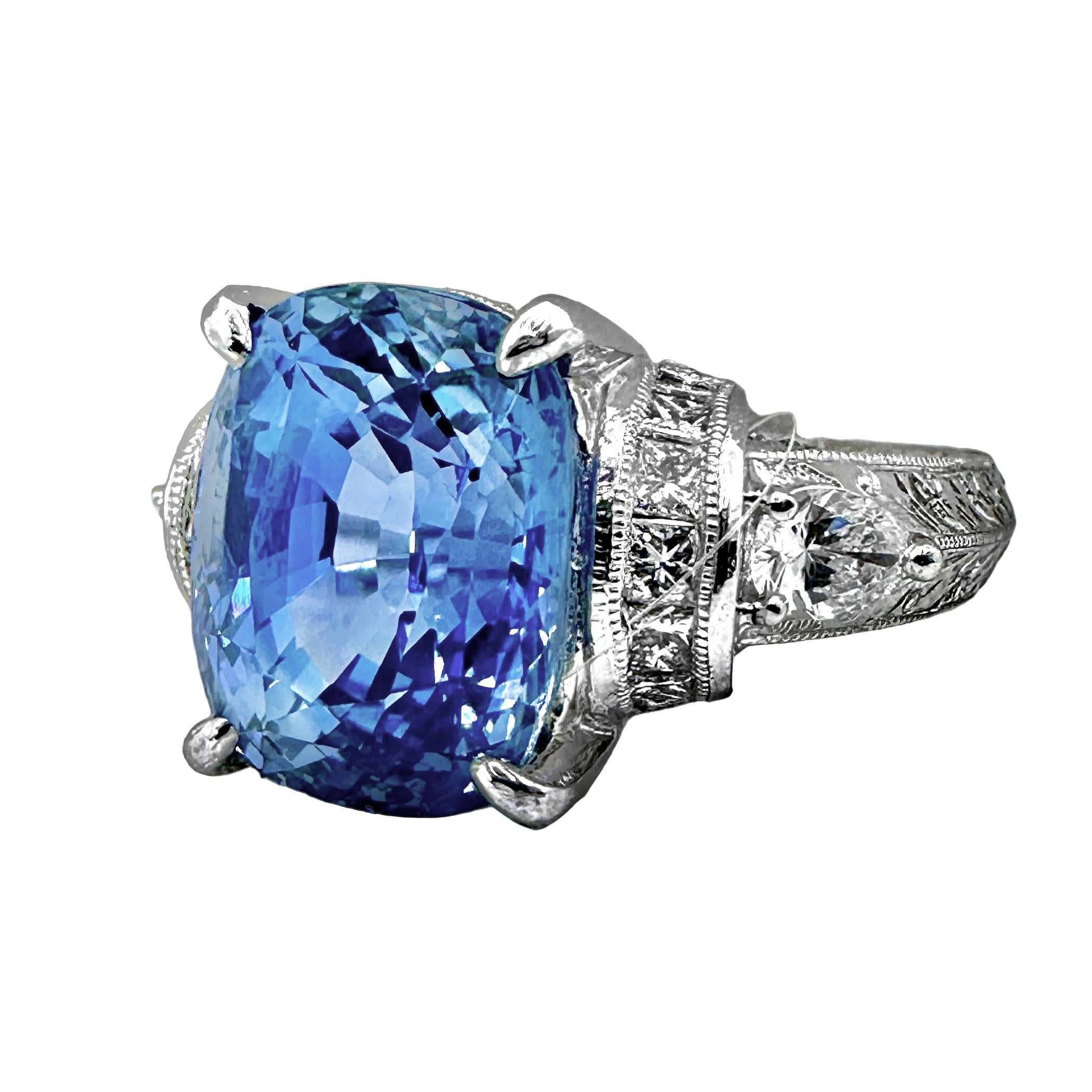 An antique style platinum ring centered around a cornflower blue, Ceylon sapphire. The sapphire is certified by Gem Research Swiss Lab with certificate number GRS2004-031142 as being natural sapphire, weighing 9.03ct, Sri Lanka in origin, with no