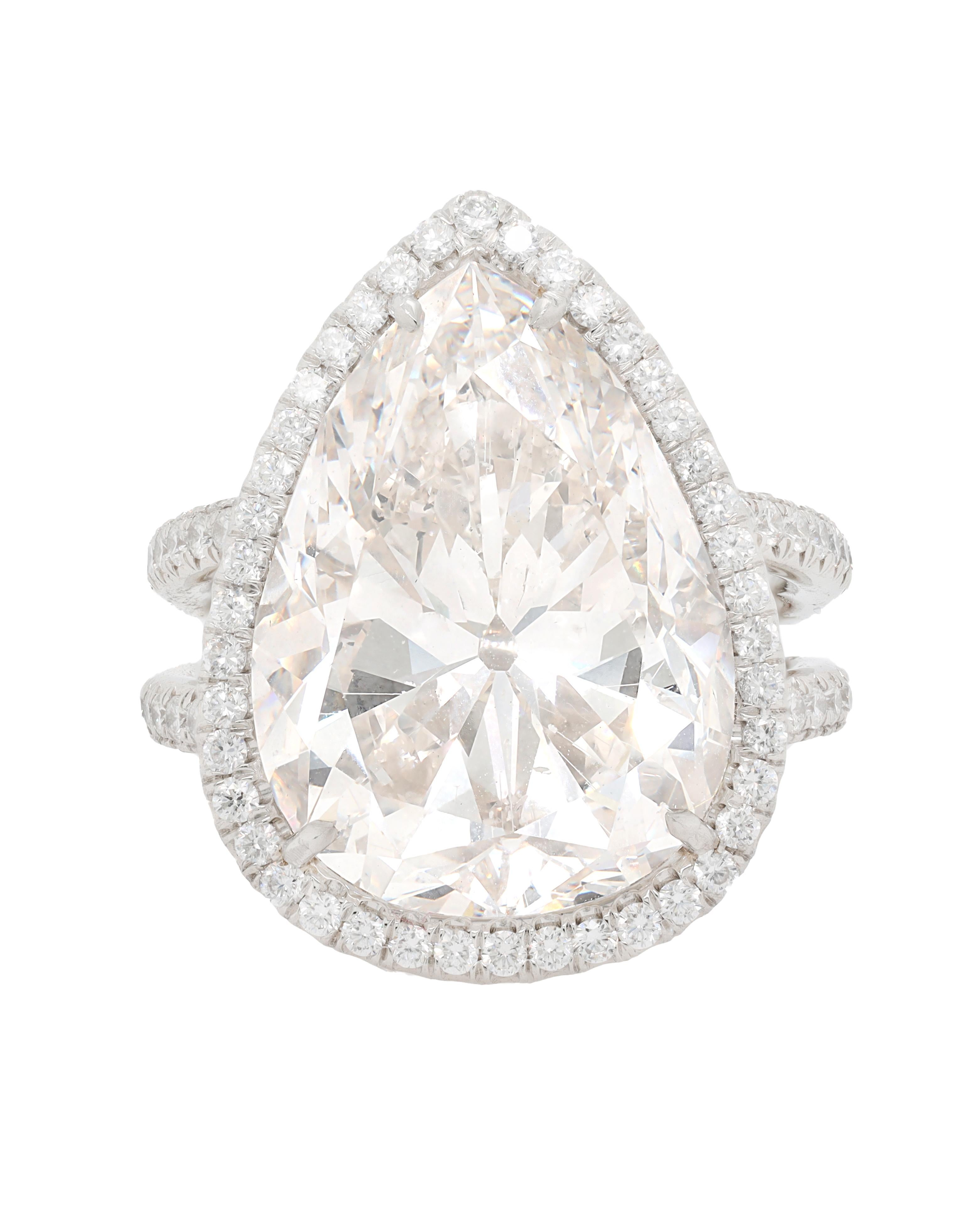 Platinum diamond ring with center EGL certified 15.01 f-si2 (psc227) pear shape diamond set micropave diamond halo split shake setting 
10/13/16
