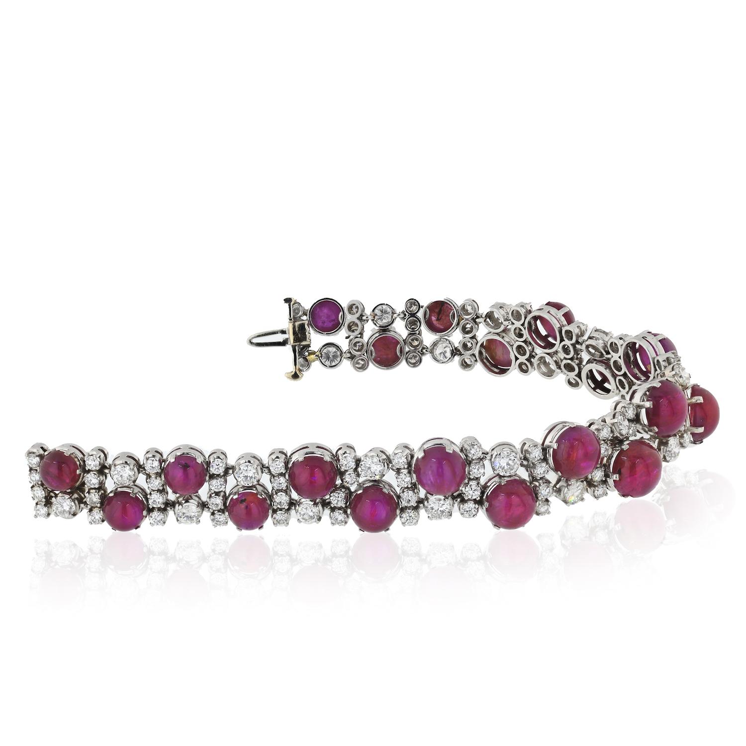 Contemporary diamond and ruby platinum bracelet. Set with brilliant-cut diamonds and cabochon rubies. 
L: 7 inches. More vintage items in our 1stDibs closet: David Webb, Tiffany, Cartier, retro, vintage, estate, and more. Contact us for more details
