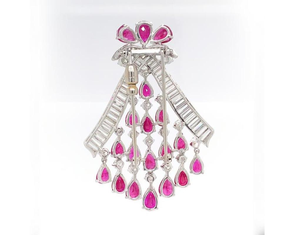 Platinum ruby diamond pin/pendant, rubies weighing 18.77 (known weight) RBC diamonds weighing approx. 2.10 cts, baguettes 5 cts, GH VS, measures 2 1/2 x 1 3/.4 inches, weight 19.1 dwt