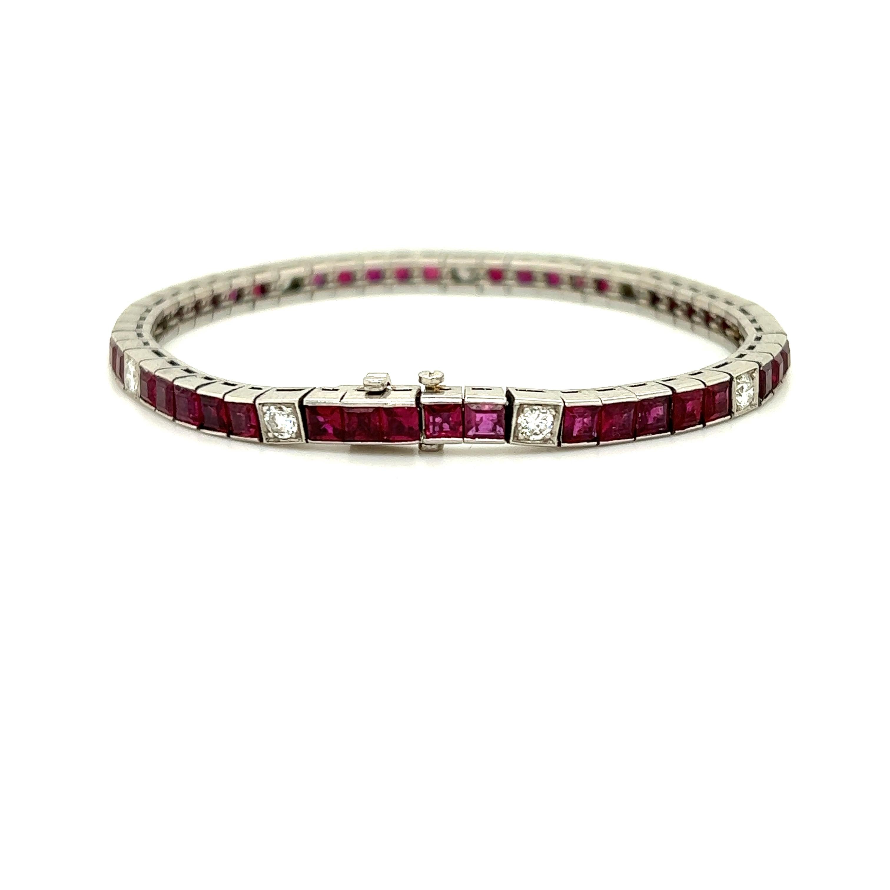 Exceptional creation crafted in platinum. This straight line tennis bracelet is crafted with earth made natural ruby gemstone and diamonds. There are 45 rubies in this design all carre cut, each weighing approximately 0.20 carat. The rubies display
