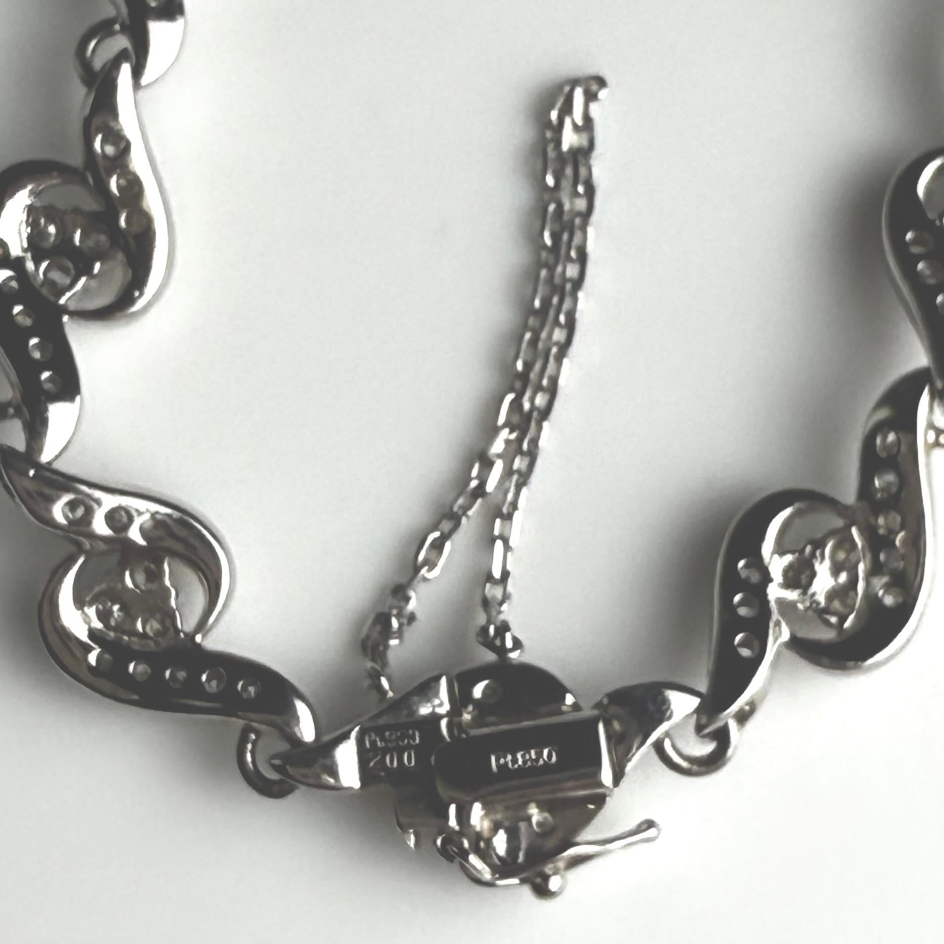 Bracelet en platine à maillons en forme de volutes de diamants pesant 2,00 carats en vente 2