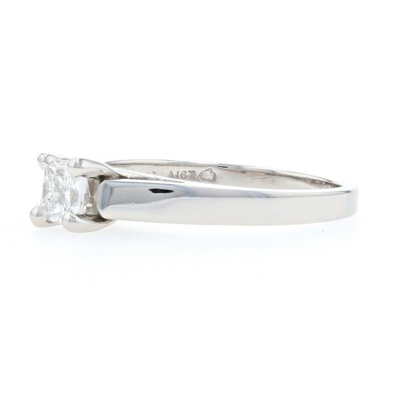 Make her sweetest dreams come true! Crafted in heirloom-quality platinum, this gorgeous engagement ring showcases a sparkling princess cut diamond solitaire held in a timelessly elegant cathedral-style mount.  

This ring is a size 7, but it can be