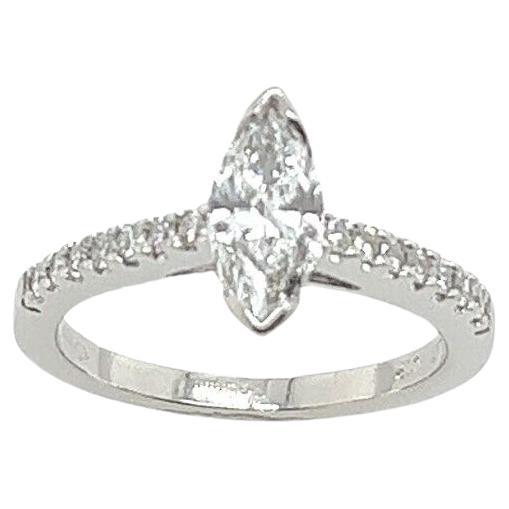 An elegant Diamond ring for your engagement, set with 0.71ct D colour VS2 clarity marquise cut natural Diamond with 0.30ct round brilliant cut small Diamonds on shoulders in a Platinum setting, with IGI certificate.

Additional Information:
Total