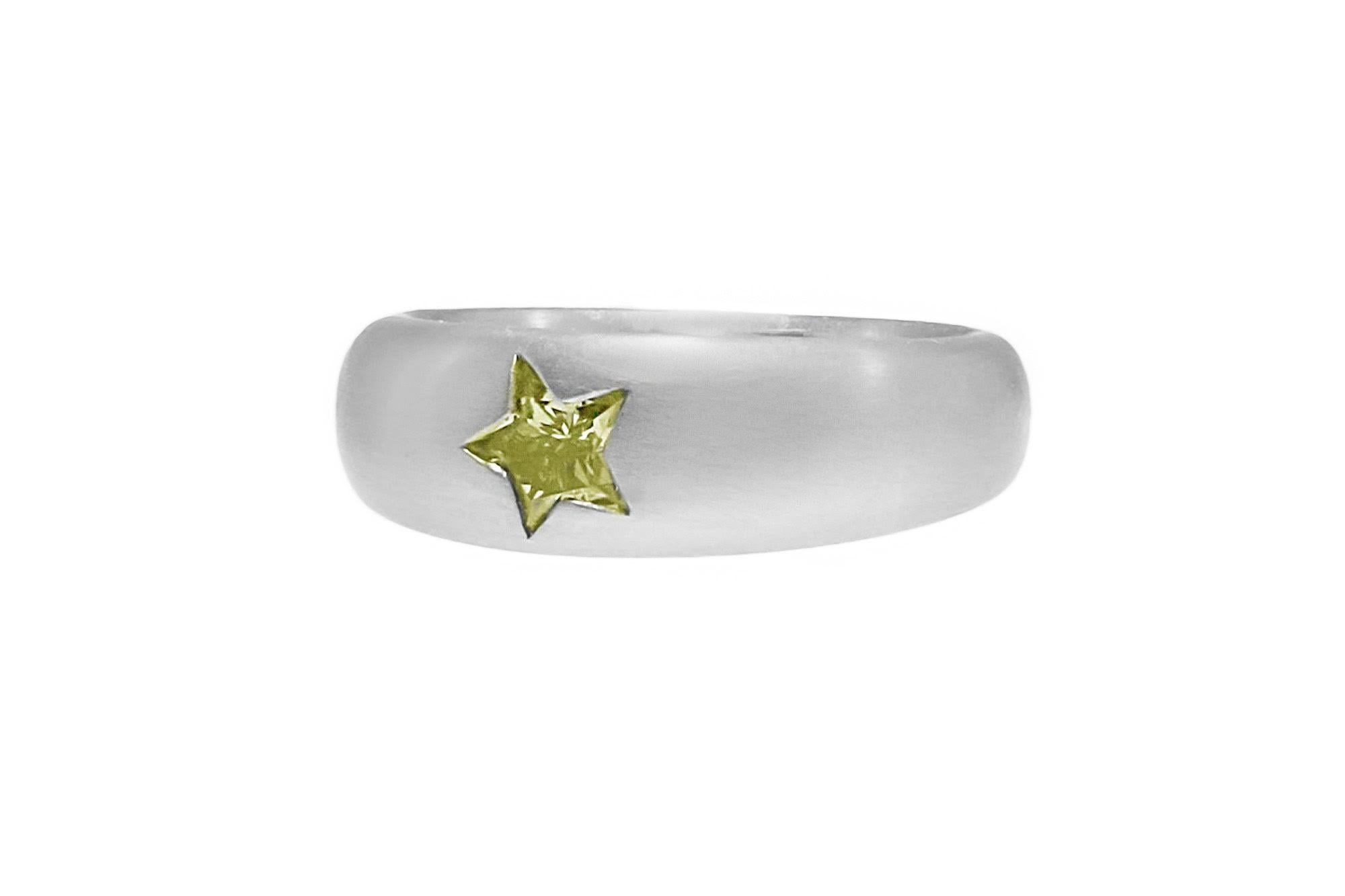 Handmade Platinum Fancy Color Diamond Ring set with a Star Cut Diamond weighting 0.50 carat.