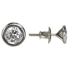Boucles d
oreilles en platine avec diamant 0.60ct