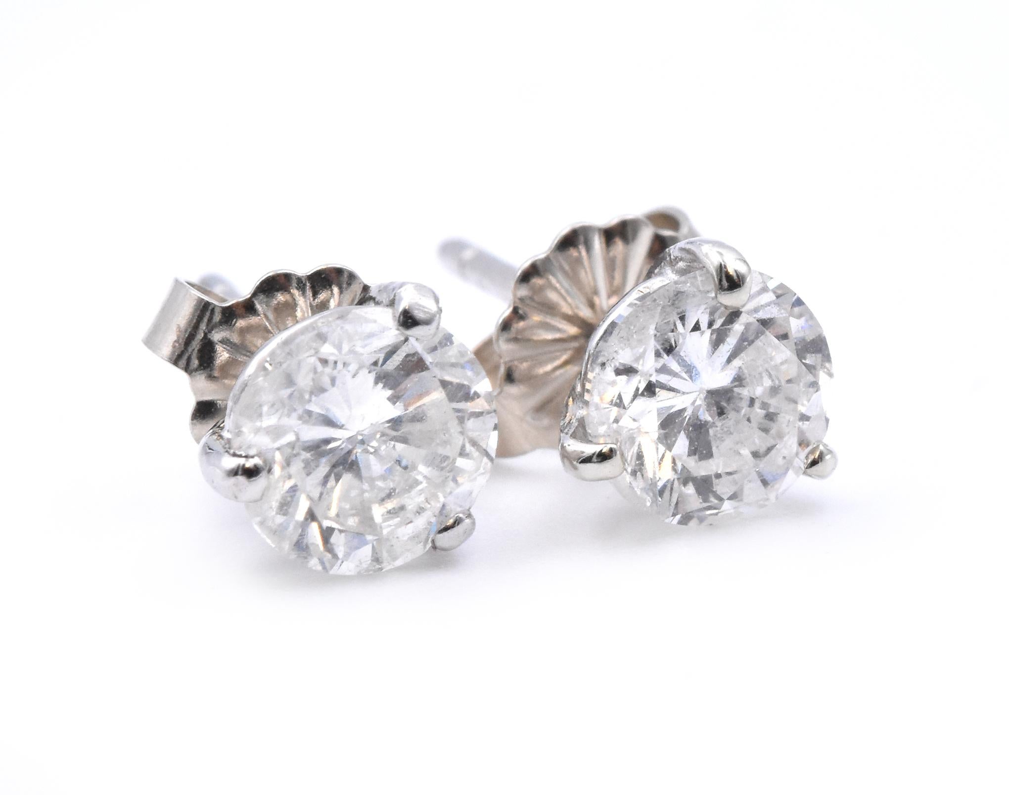 Material: platinum  
Diamond: 1 round brilliant cut = .67ct
Color: H
Clarity: I1
Diamond: 1 round brilliant cut = .70ct
Color: H
Clarity: I1
Dimensions: earrings measure approximately 5.7mm
Fastenings: post with friction backs 
Weight:  1.4 grams