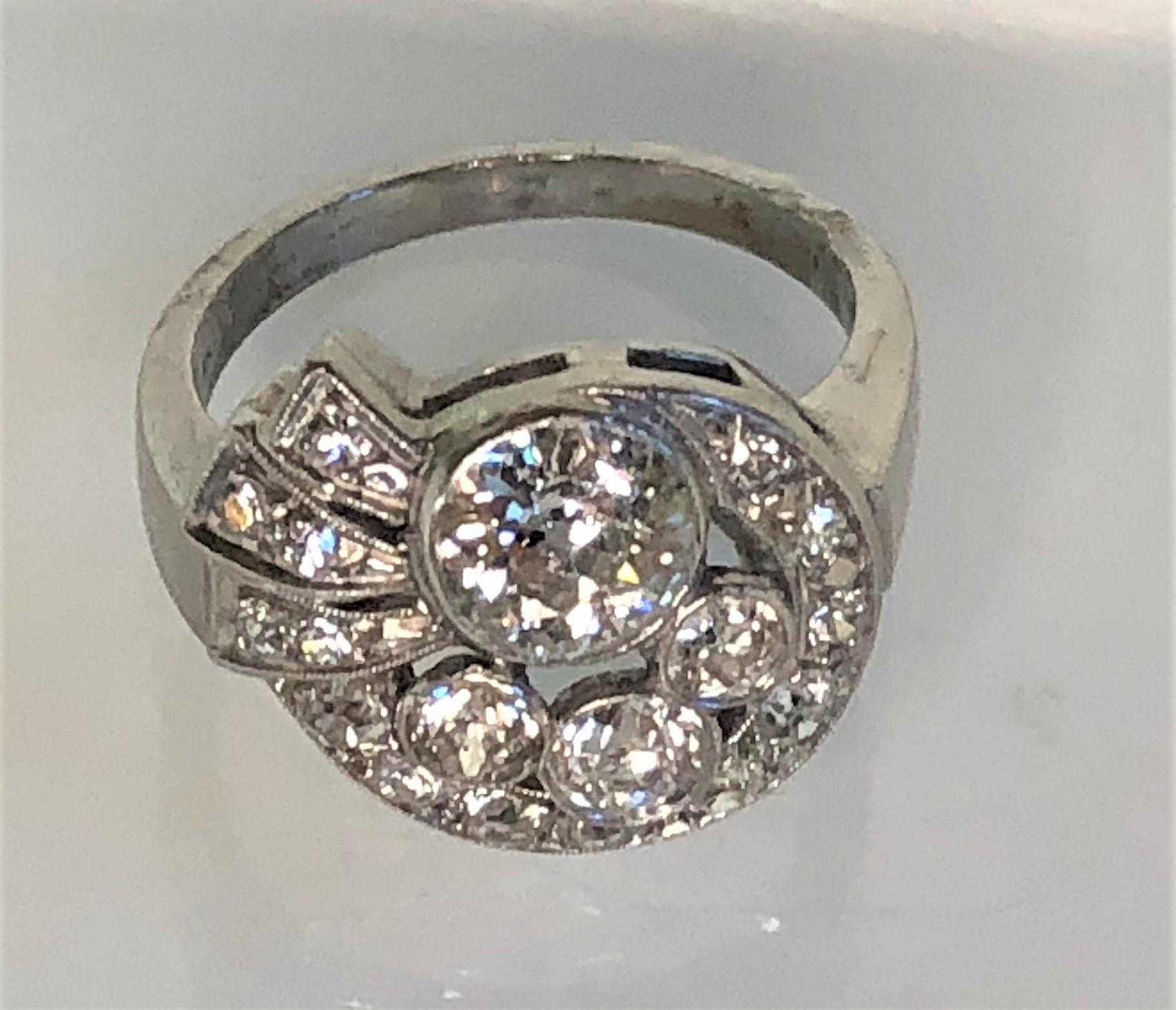 This special ring will grab attention!  Beautiful sparkly diamonds.
Platinum swirl design with lots of detail!
18 total diamonds, approximately 1.25 total diamond weight
Center diamond approximately .75 ct
Other diamonds approximately .005 to .20 ct